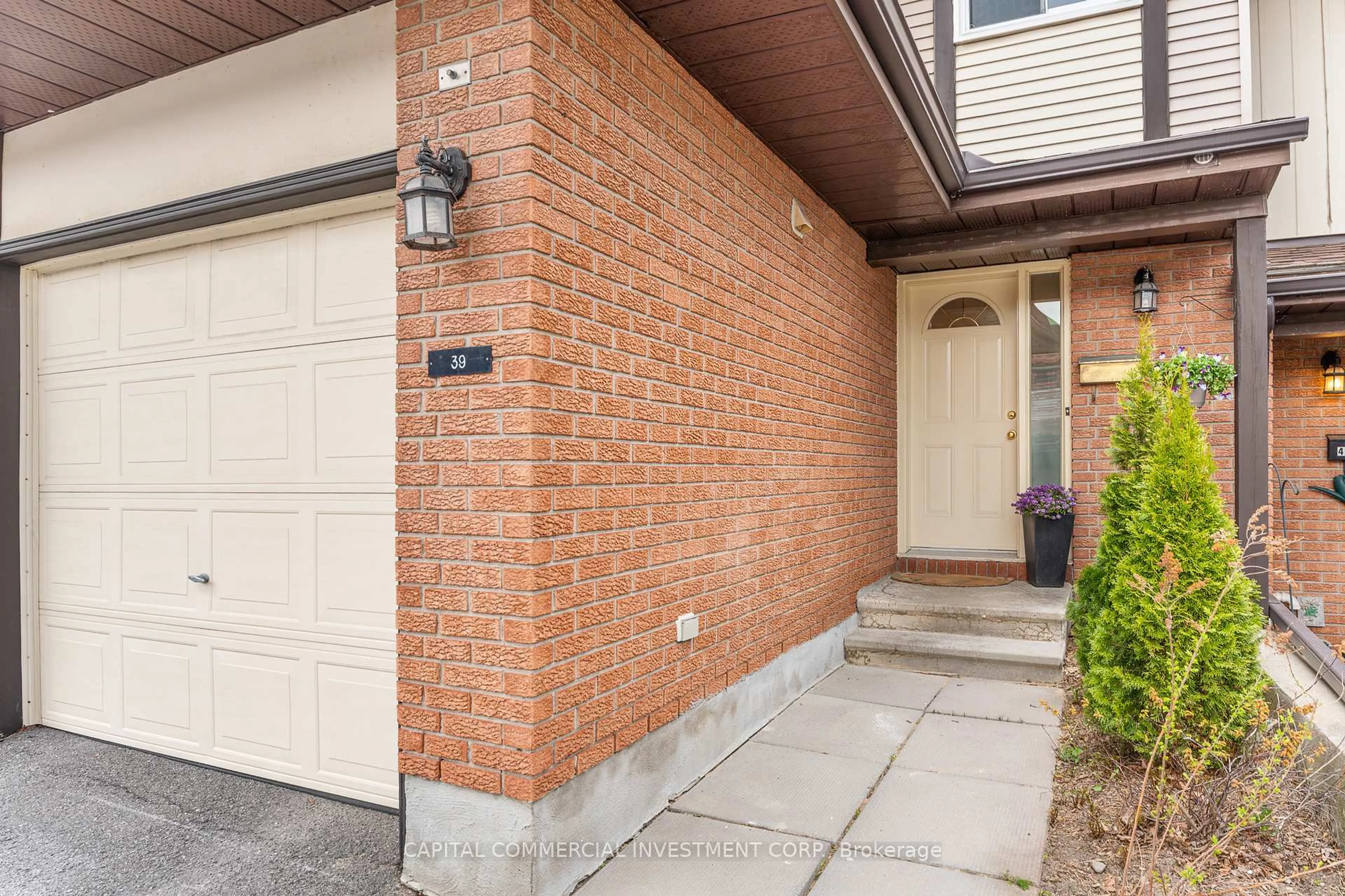 Home with brick exterior material, street for 39 Clarkson Cres #10, Ottawa Ontario K2L 3C9