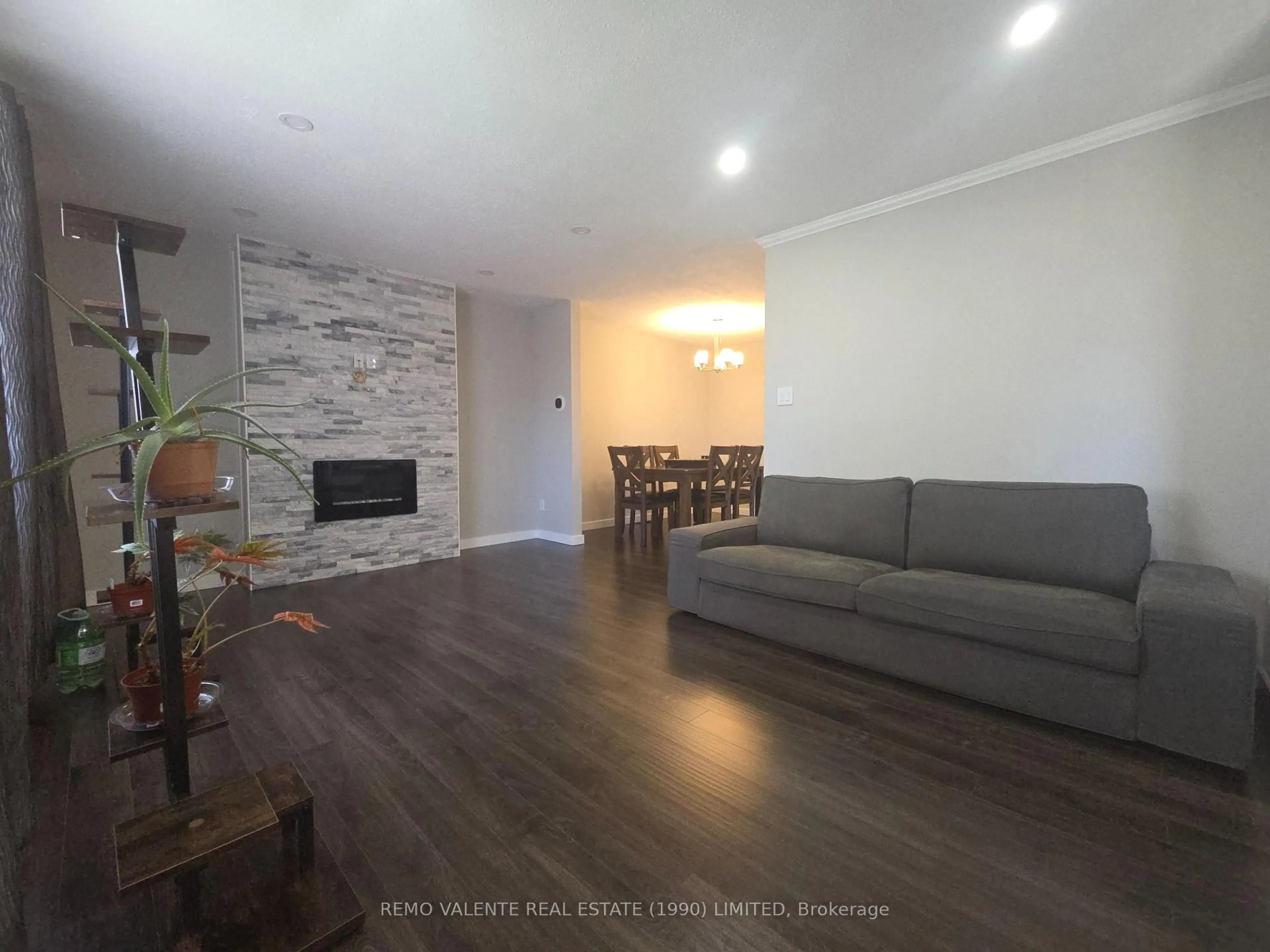 Living room with furniture, wood/laminate floor for 83 Genevive Pl, London East Ontario N5Y 4X2