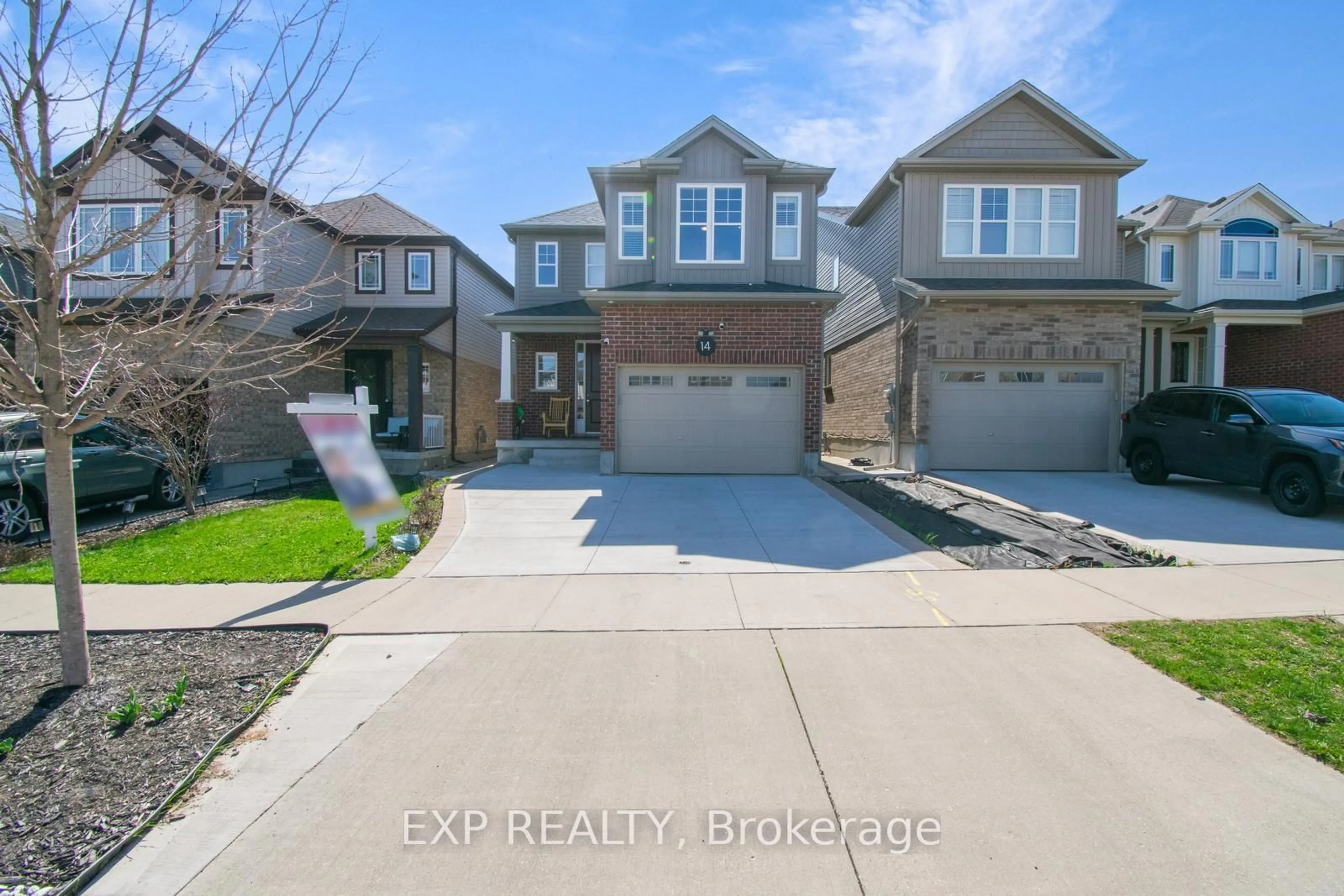 Home with brick exterior material, street for 14 Willowrun Dr, Kitchener Ontario N2A 0H5