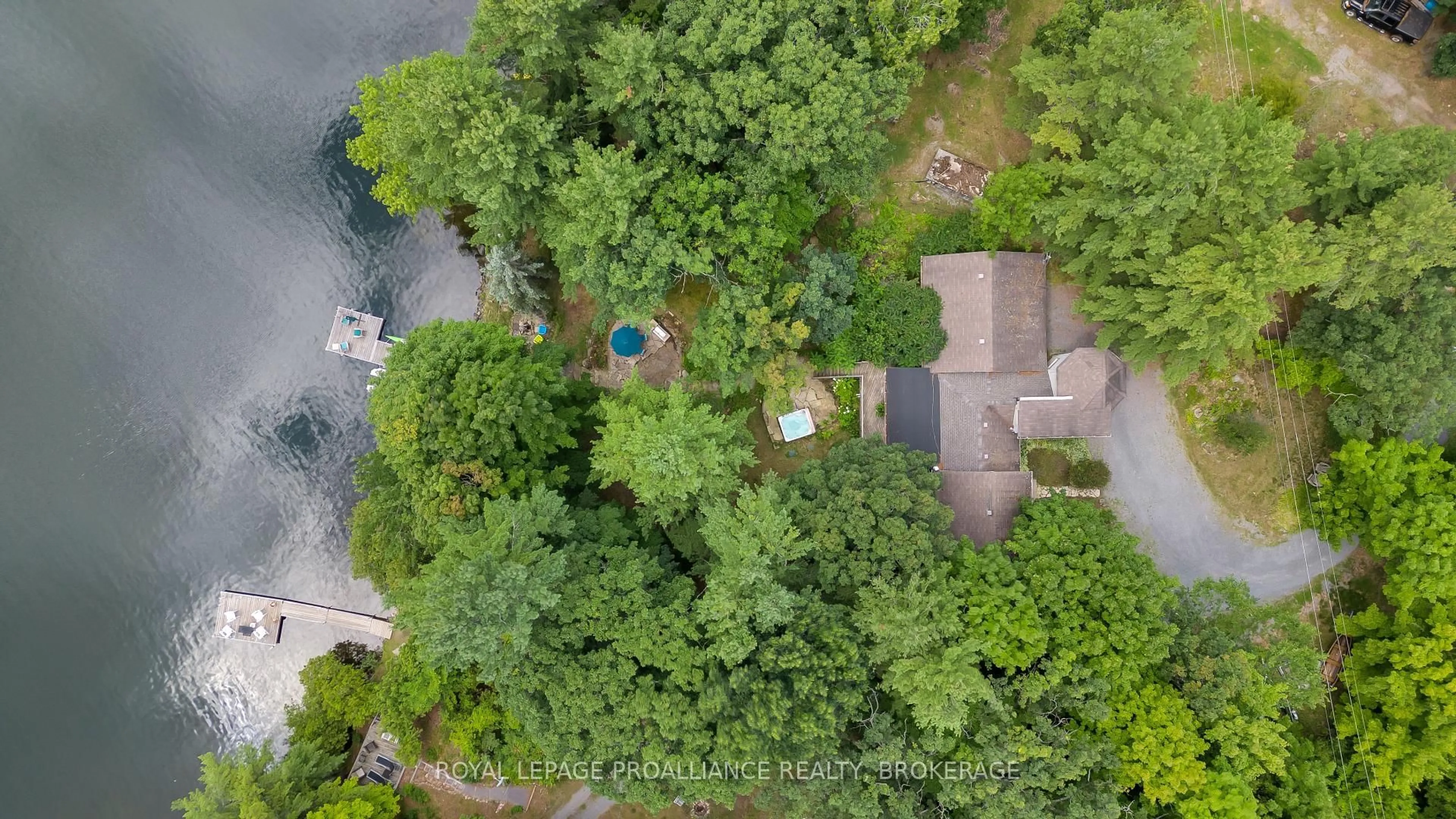 A pic from outside/outdoor area/front of a property/back of a property/a pic from drone, water/lake/river/ocean view for 18 Hickory Lane, Perth Road Ontario K0H 2L0