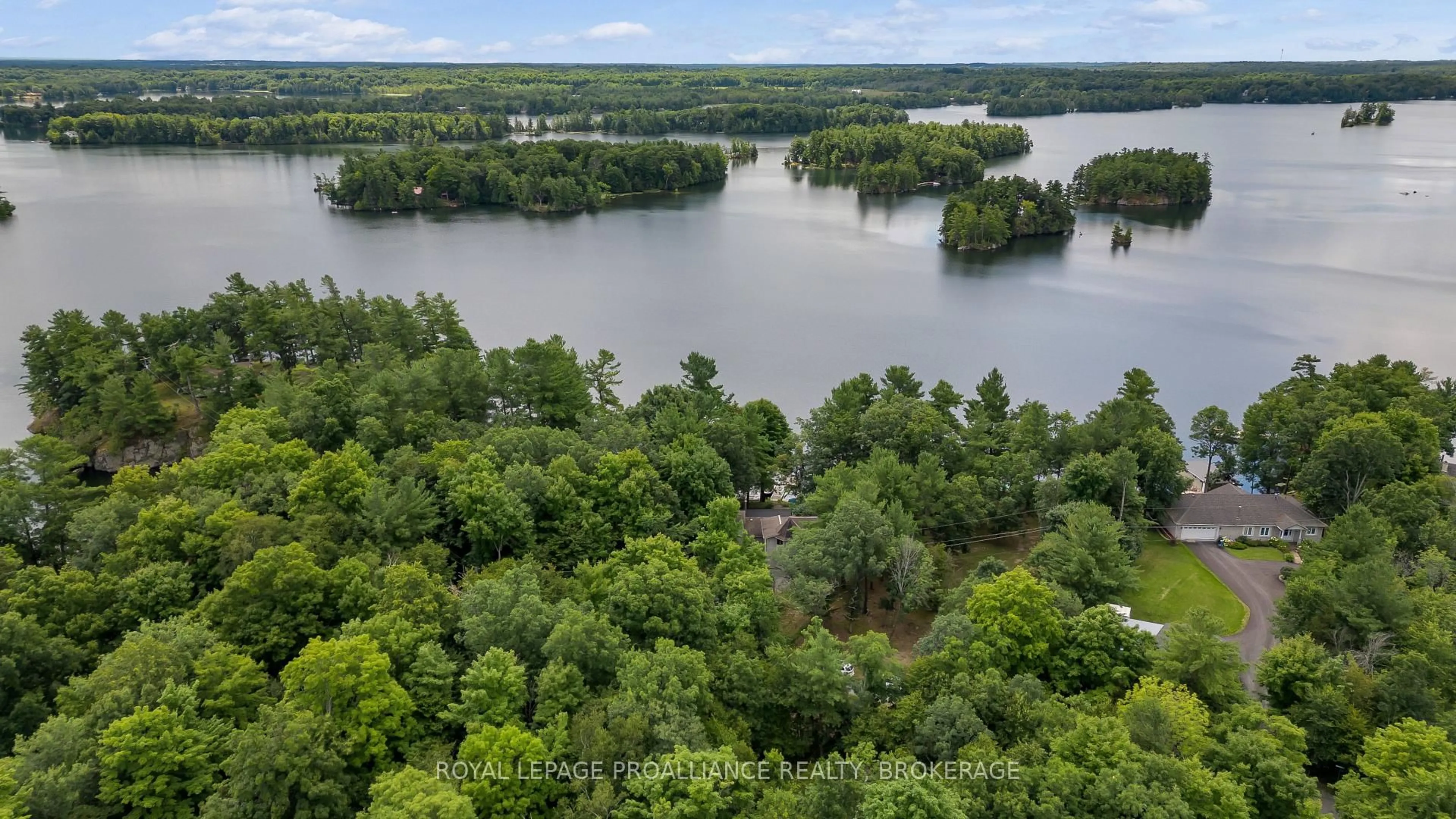 A pic from outside/outdoor area/front of a property/back of a property/a pic from drone, water/lake/river/ocean view for 18 Hickory Lane, Perth Road Ontario K0H 2L0