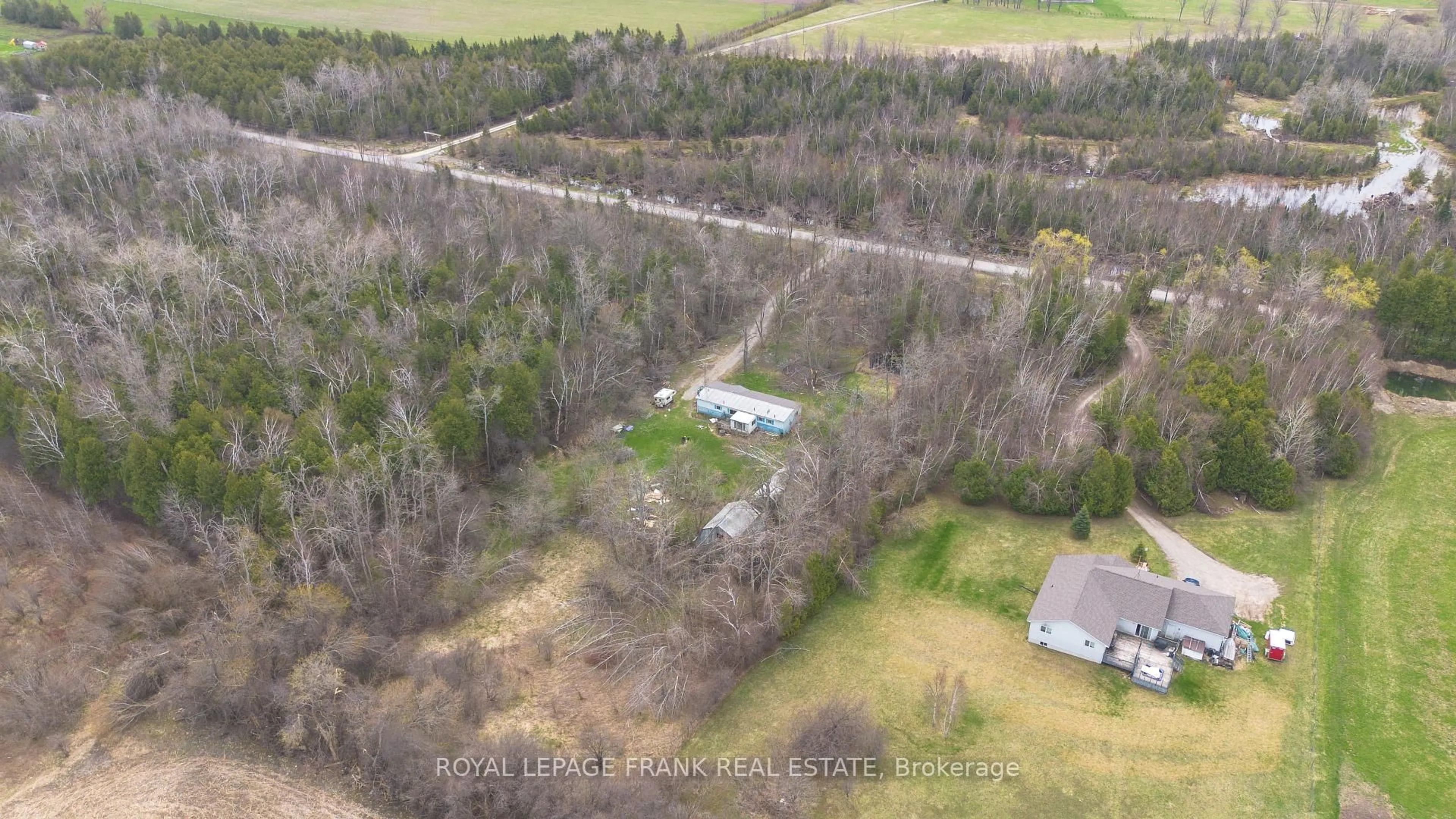 A pic from outside/outdoor area/front of a property/back of a property/a pic from drone, forest/trees view for 35 Elmtree Rd, Kawartha Lakes Ontario K0M 2C0