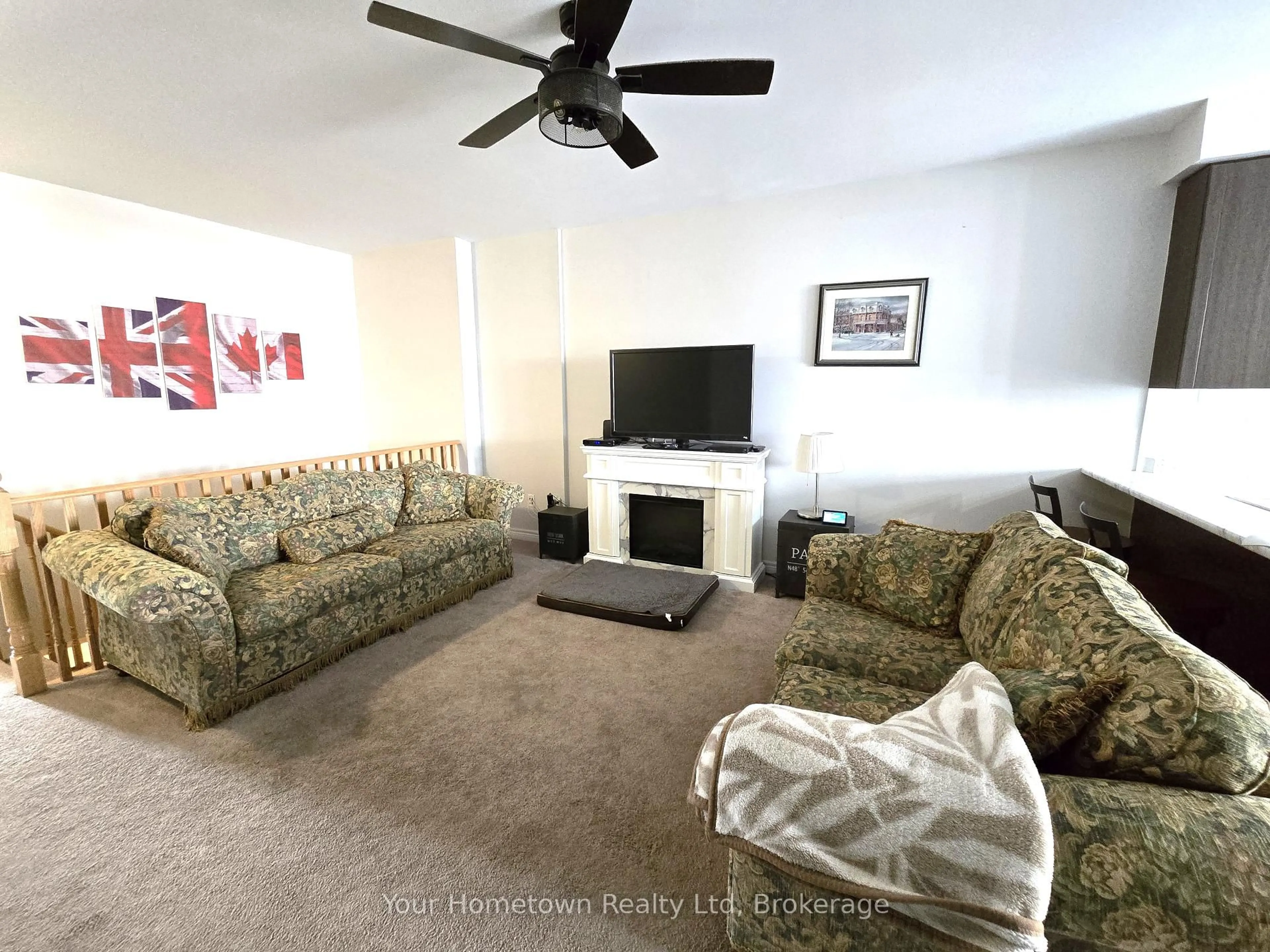 Living room with furniture, carpet floor for 28 Middleton Ave, Centre Wellington Ontario N1M 0G2