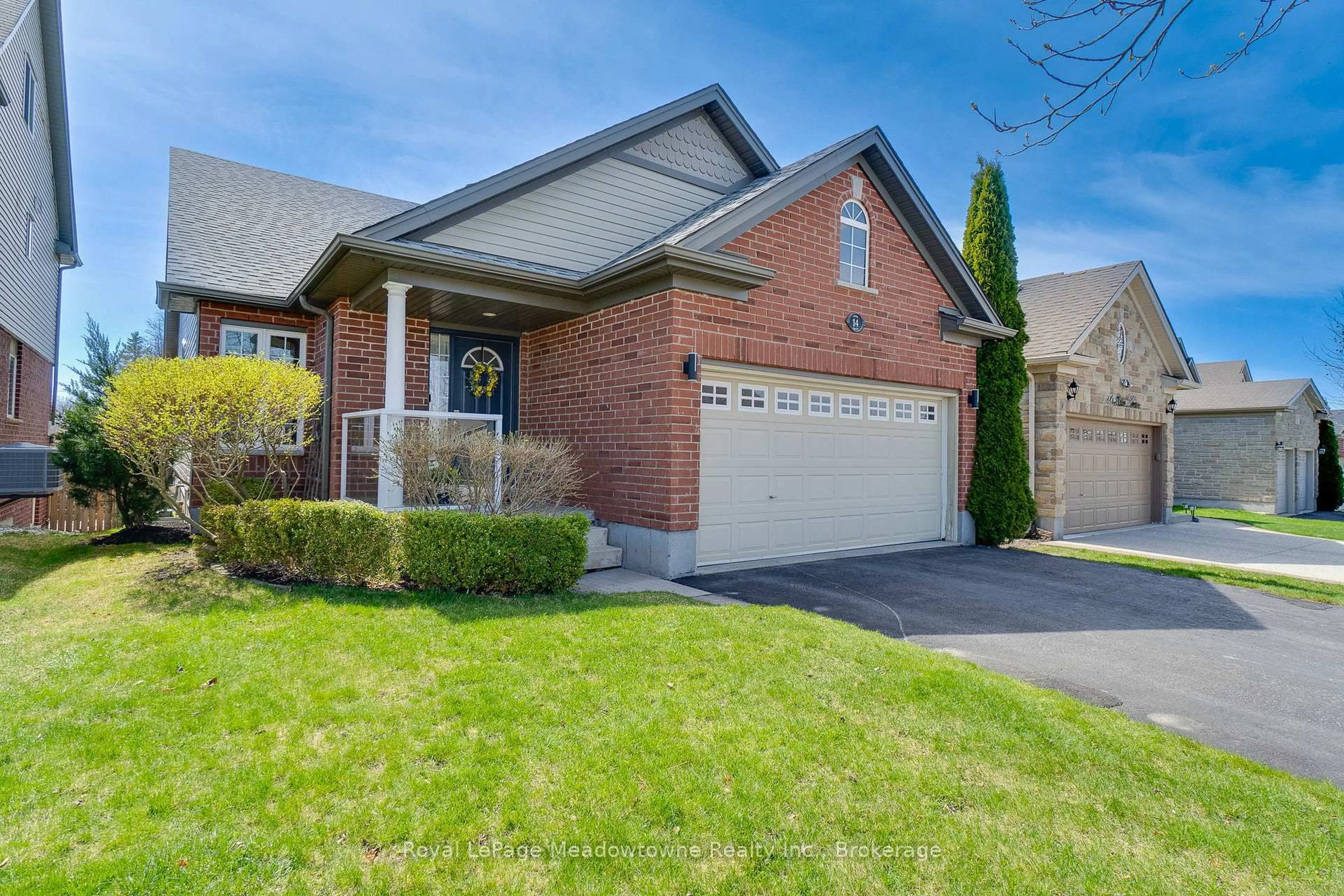 Home with brick exterior material, street for 14 Atto Dr, Guelph Ontario N1E 0E4