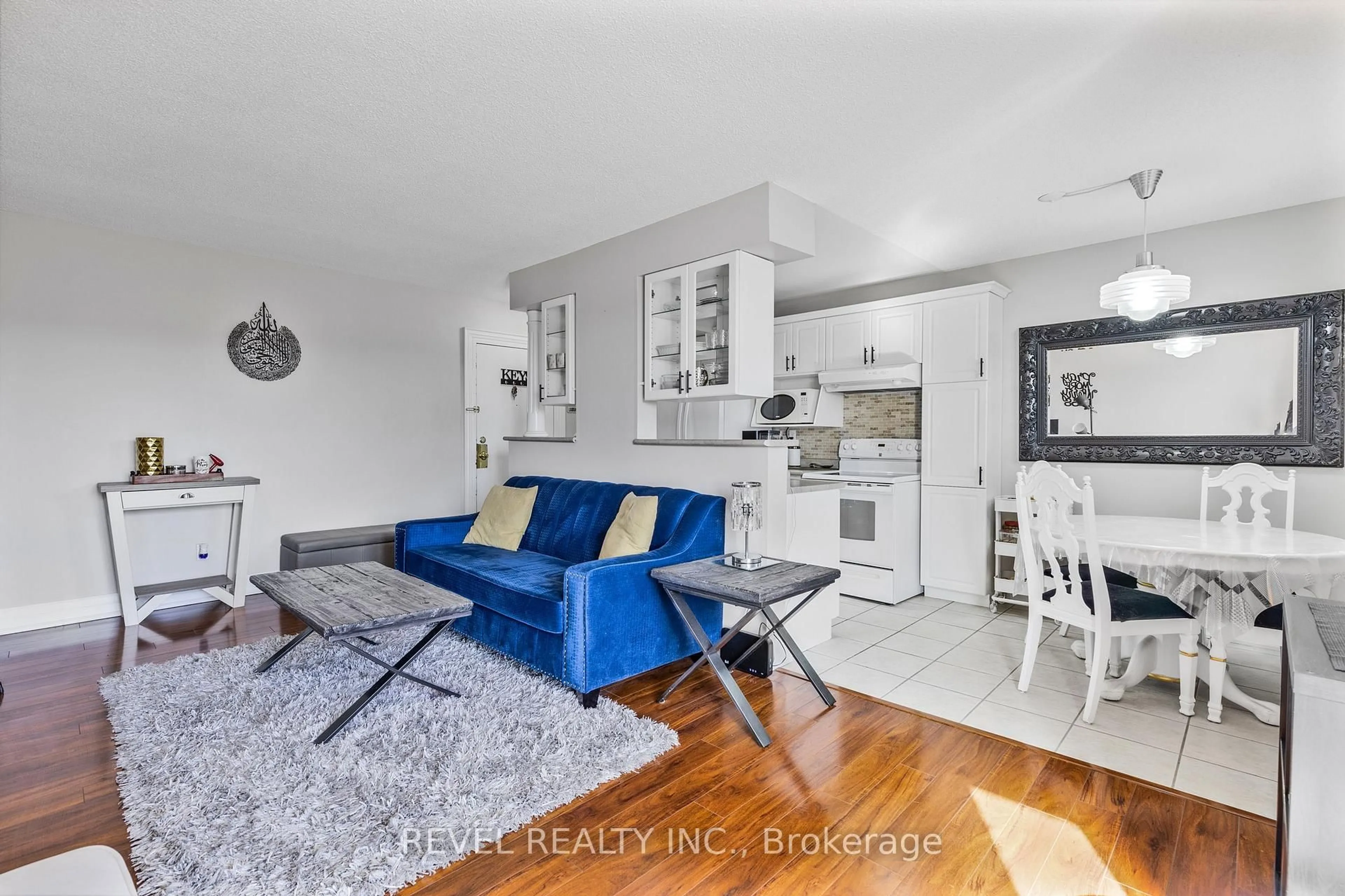 Living room with furniture, unknown for 851 Queenston Rd #406, Hamilton Ontario L8G 1B4