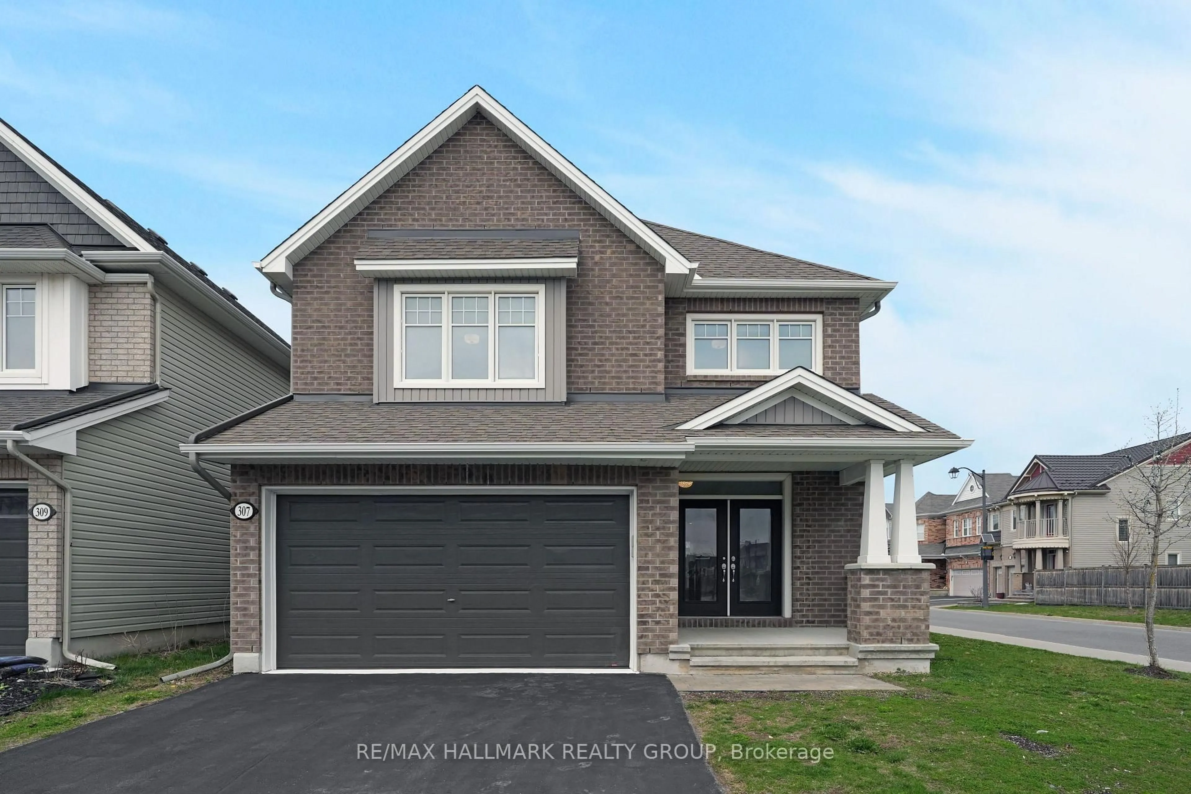 Home with brick exterior material, street for 307 BRAMBLING Way, Ottawa Ontario K2J 6E4