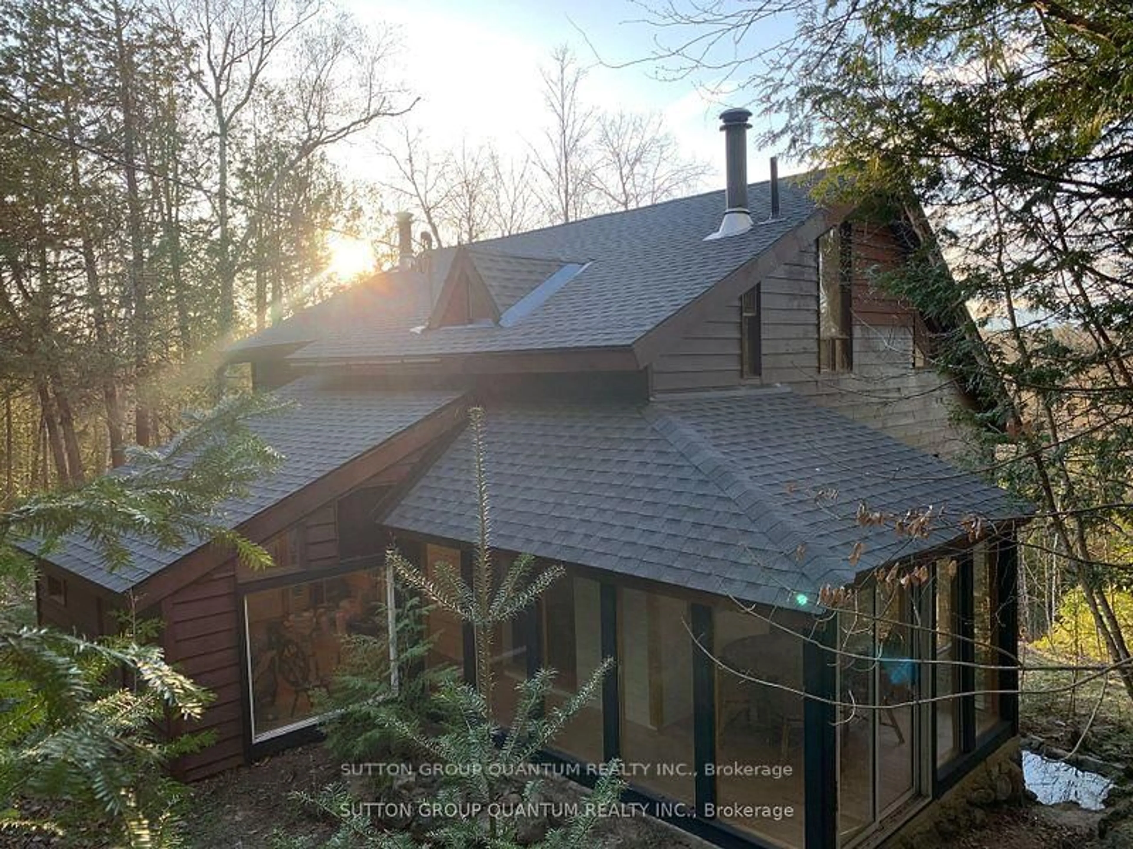 A pic from outside/outdoor area/front of a property/back of a property/a pic from drone, forest/trees view for 2724 River Rd, Ompah Ontario K0H 2J0