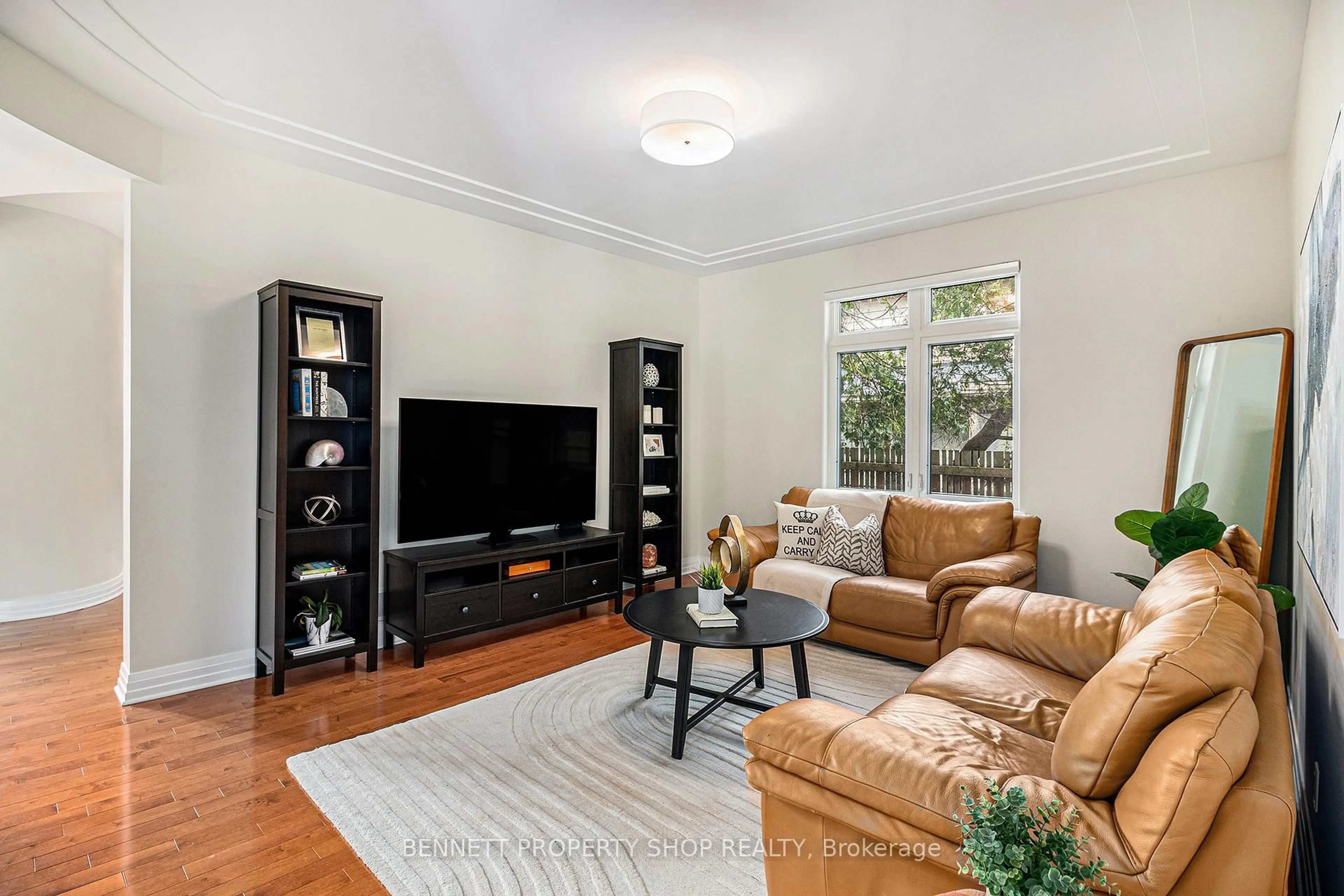 Living room with furniture, wood/laminate floor for 1934 Lenester Ave, Ottawa Ontario K2A 1J9
