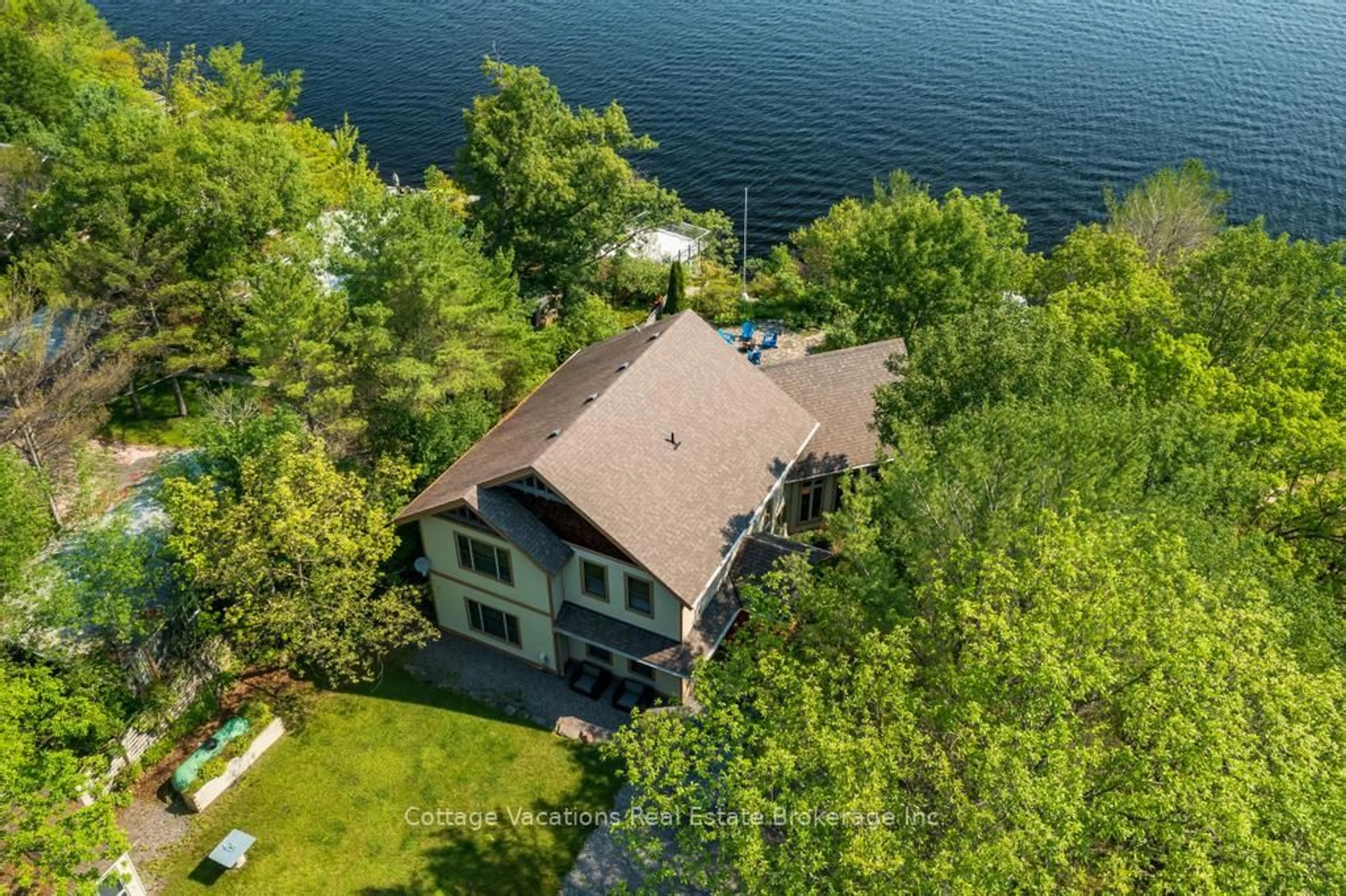 A pic from outside/outdoor area/front of a property/back of a property/a pic from drone, water/lake/river/ocean view for 1016 Lawland Heights Rd, Gravenhurst Ontario P1P 1R2