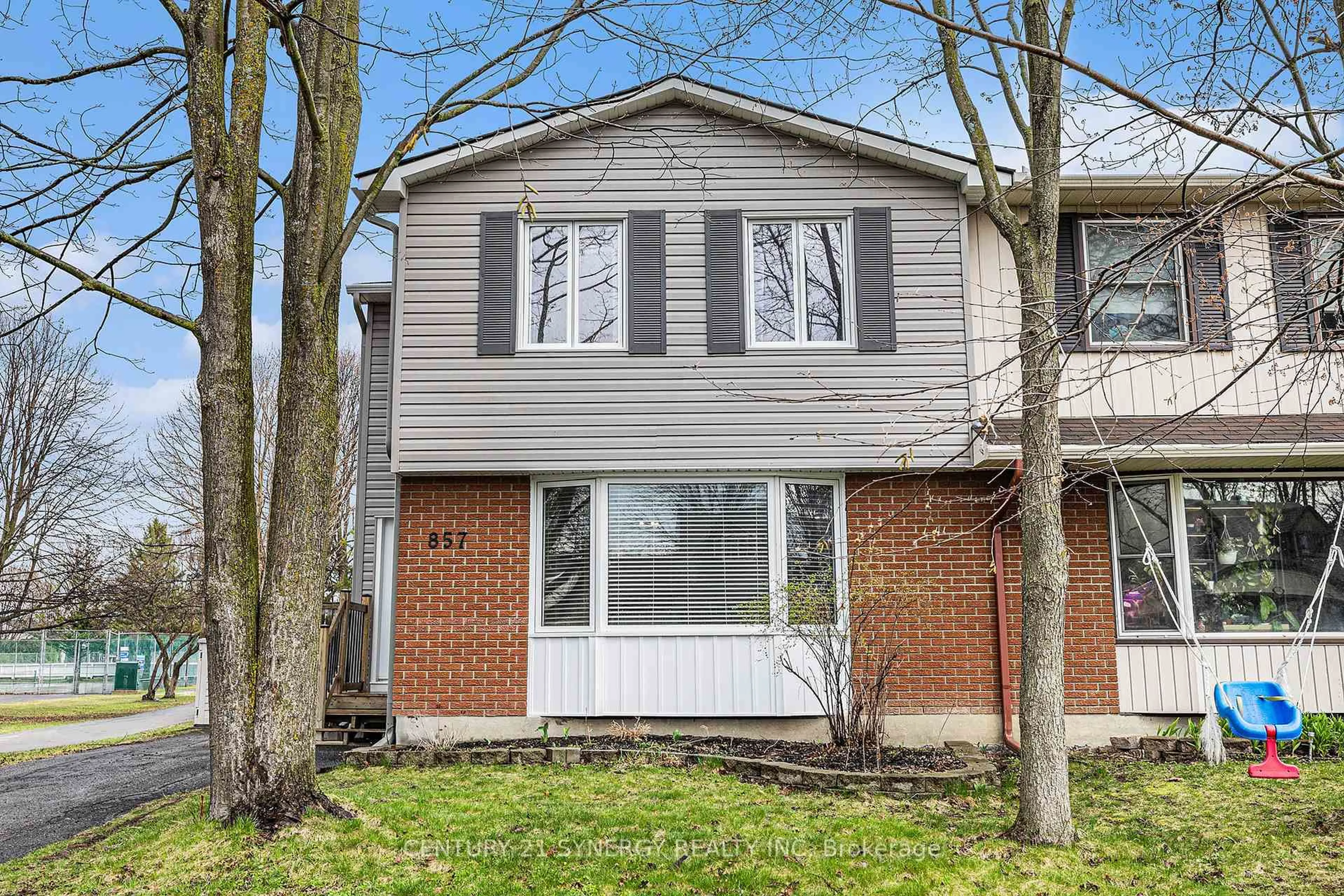 Home with brick exterior material, street for 857 Lawnsberry Dr, Ottawa Ontario K1E 1X8