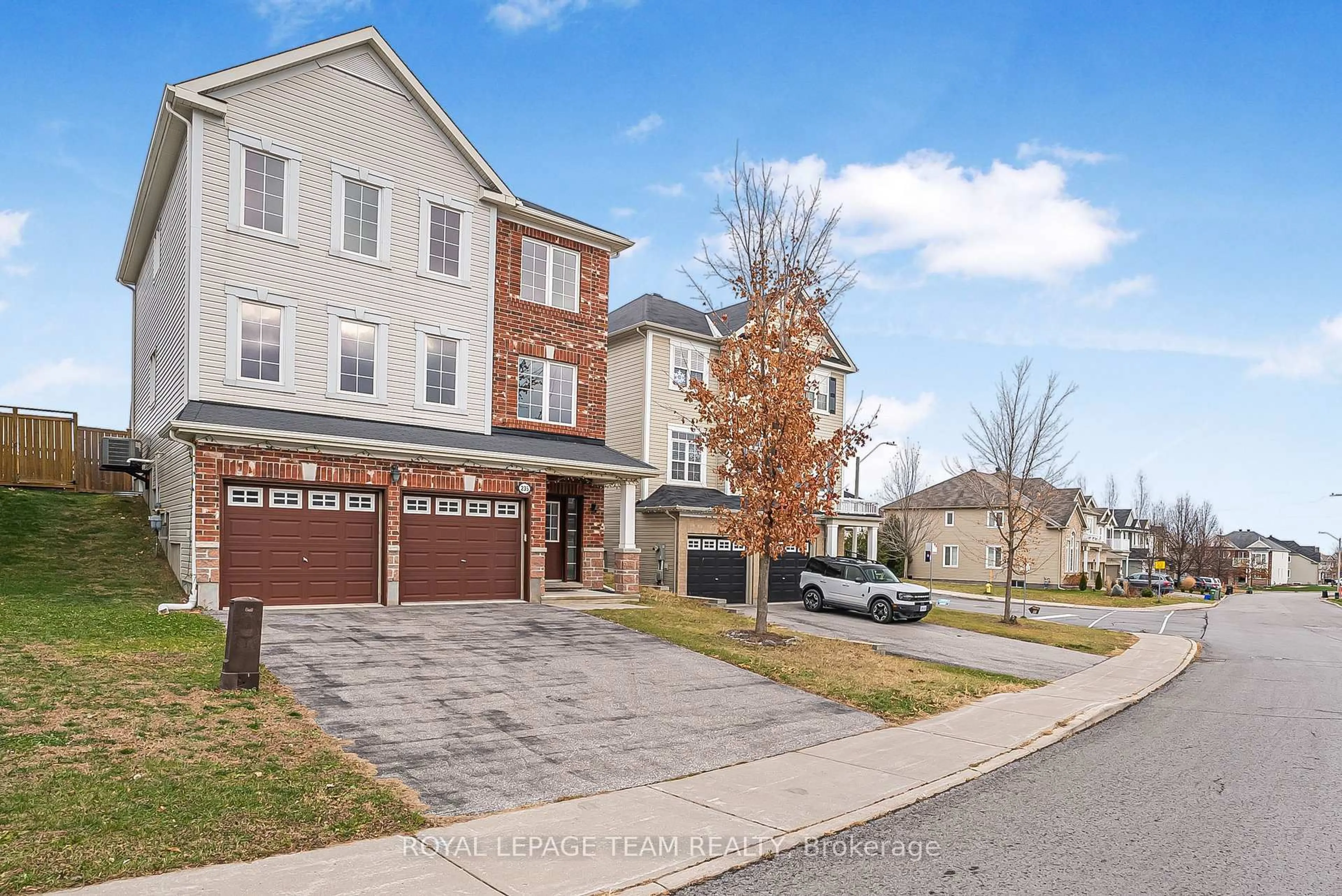 Home with brick exterior material, street for 235 HUNTSVILLE Dr, Ottawa Ontario K2T 0C7