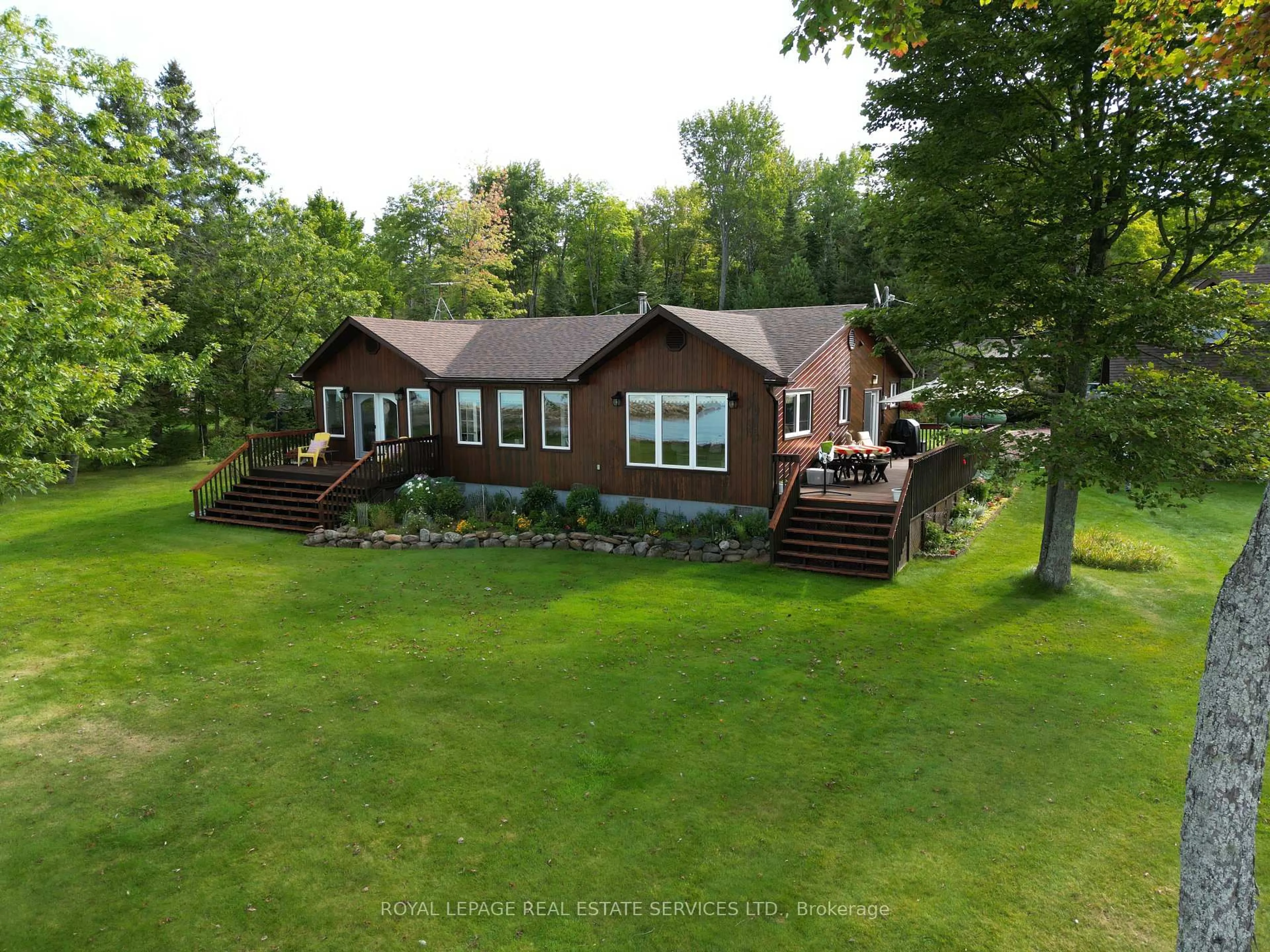 A pic from outside/outdoor area/front of a property/back of a property/a pic from drone, water/lake/river/ocean view for 525 Riverside Dr, St. Joseph Ontario P0R 1J0