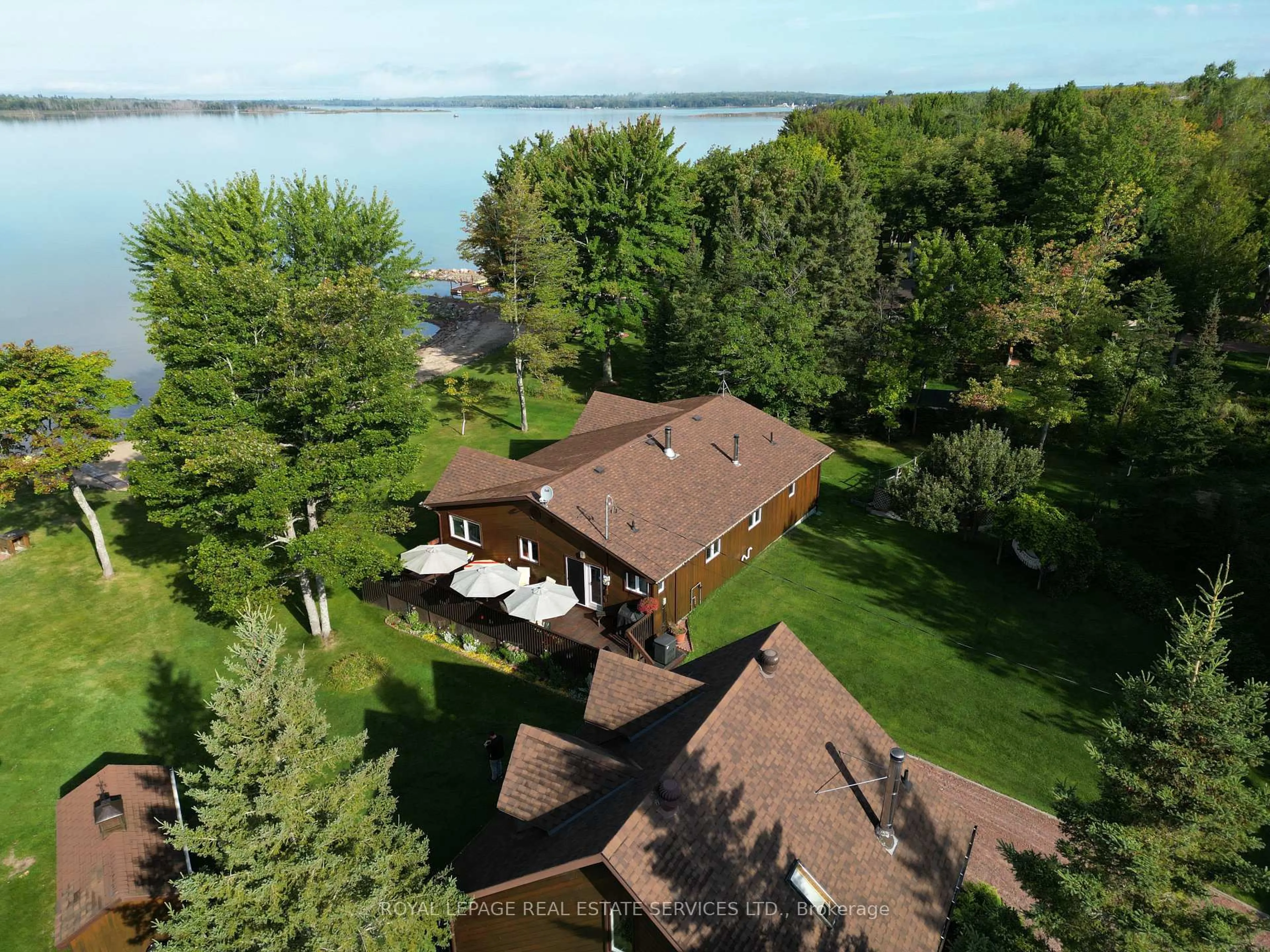 A pic from outside/outdoor area/front of a property/back of a property/a pic from drone, water/lake/river/ocean view for 525 Riverside Dr, St. Joseph Ontario P0R 1J0