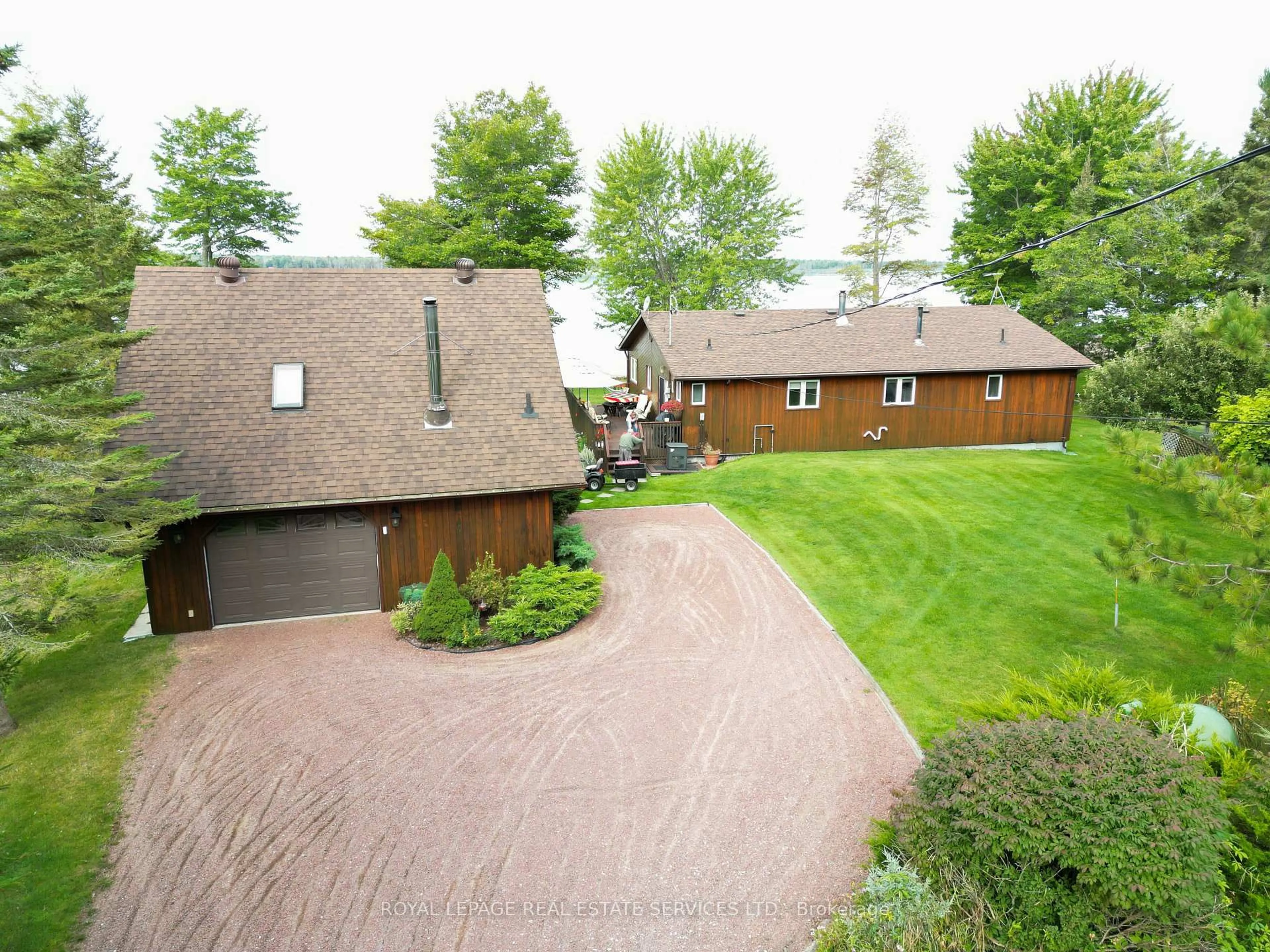 A pic from outside/outdoor area/front of a property/back of a property/a pic from drone, street for 525 Riverside Dr, St. Joseph Ontario P0R 1J0