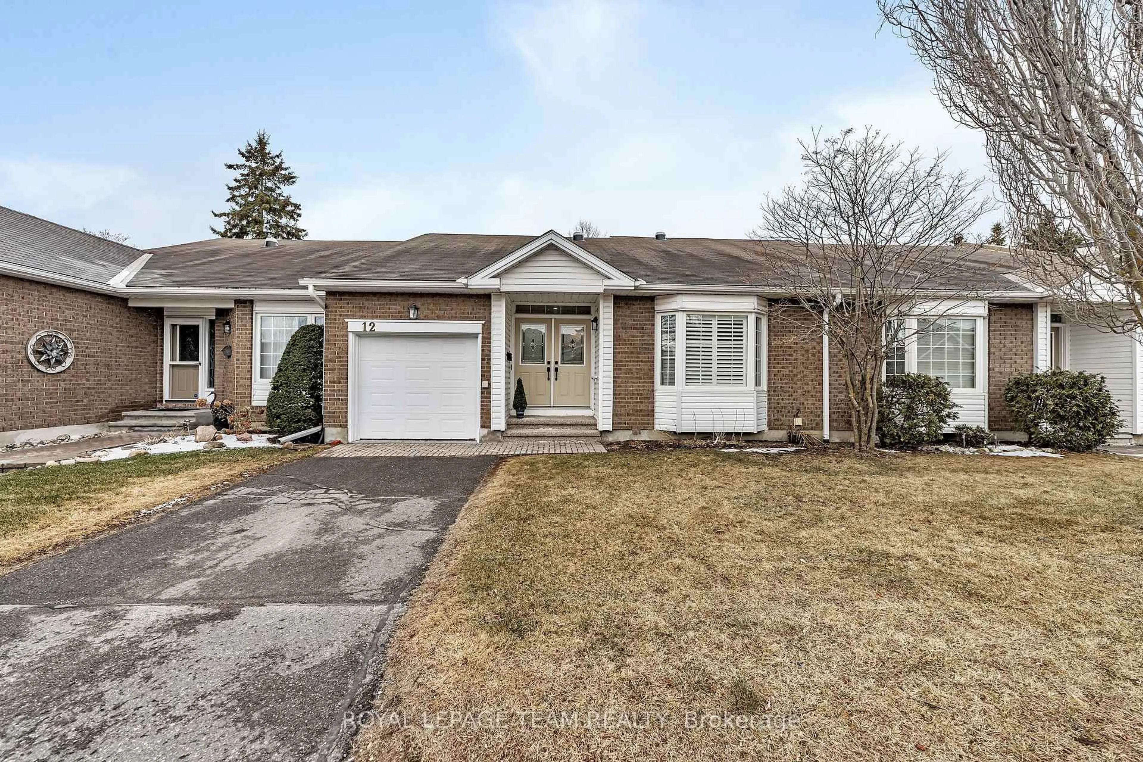 Home with brick exterior material, street for 12 Grand Harbour Crt, Stittsville Ontario K2S 1H1