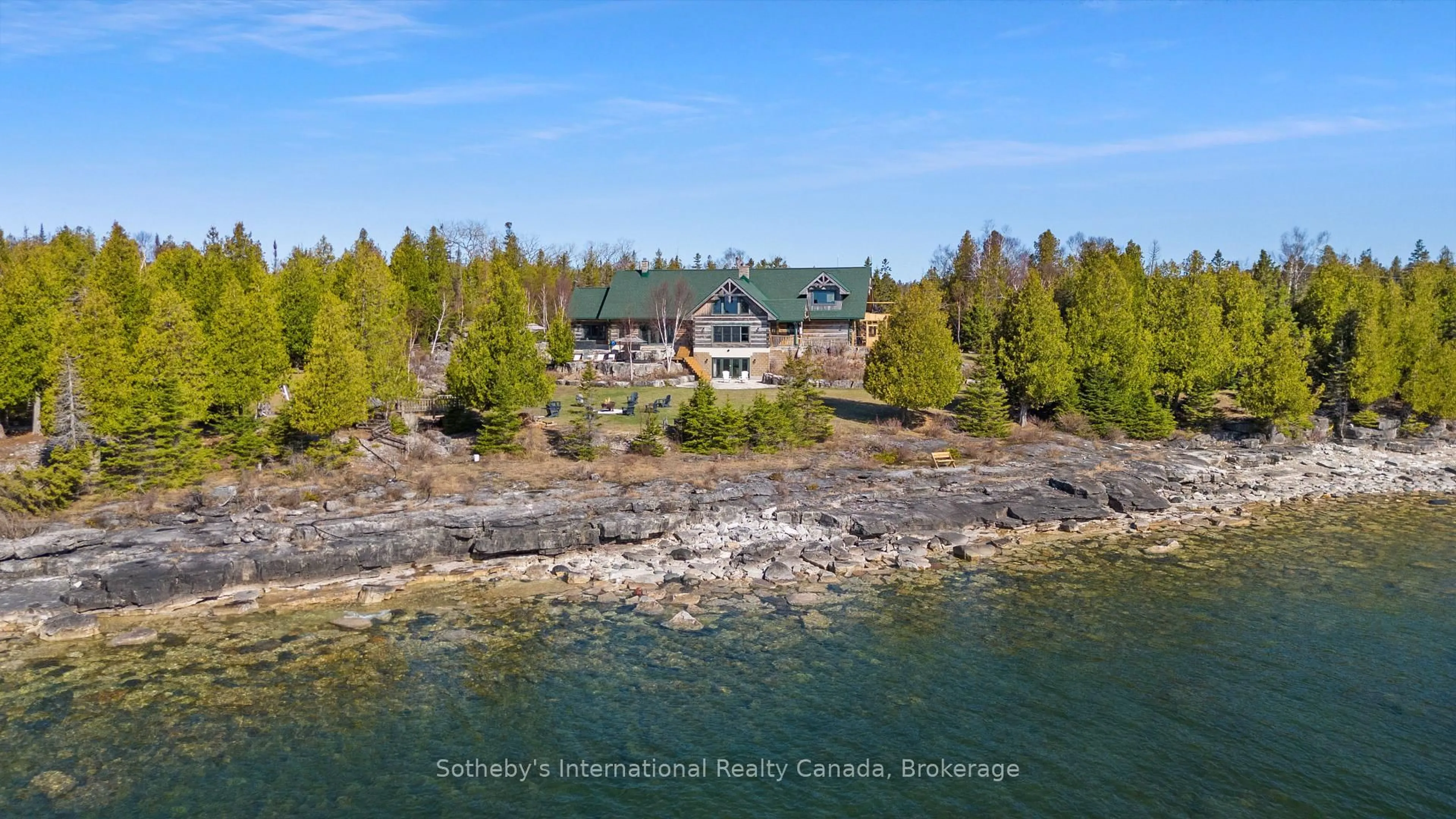 A pic from outside/outdoor area/front of a property/back of a property/a pic from drone, water/lake/river/ocean view for 191-221 Pennie Ave, Tehkummah Ontario P0P 2C0