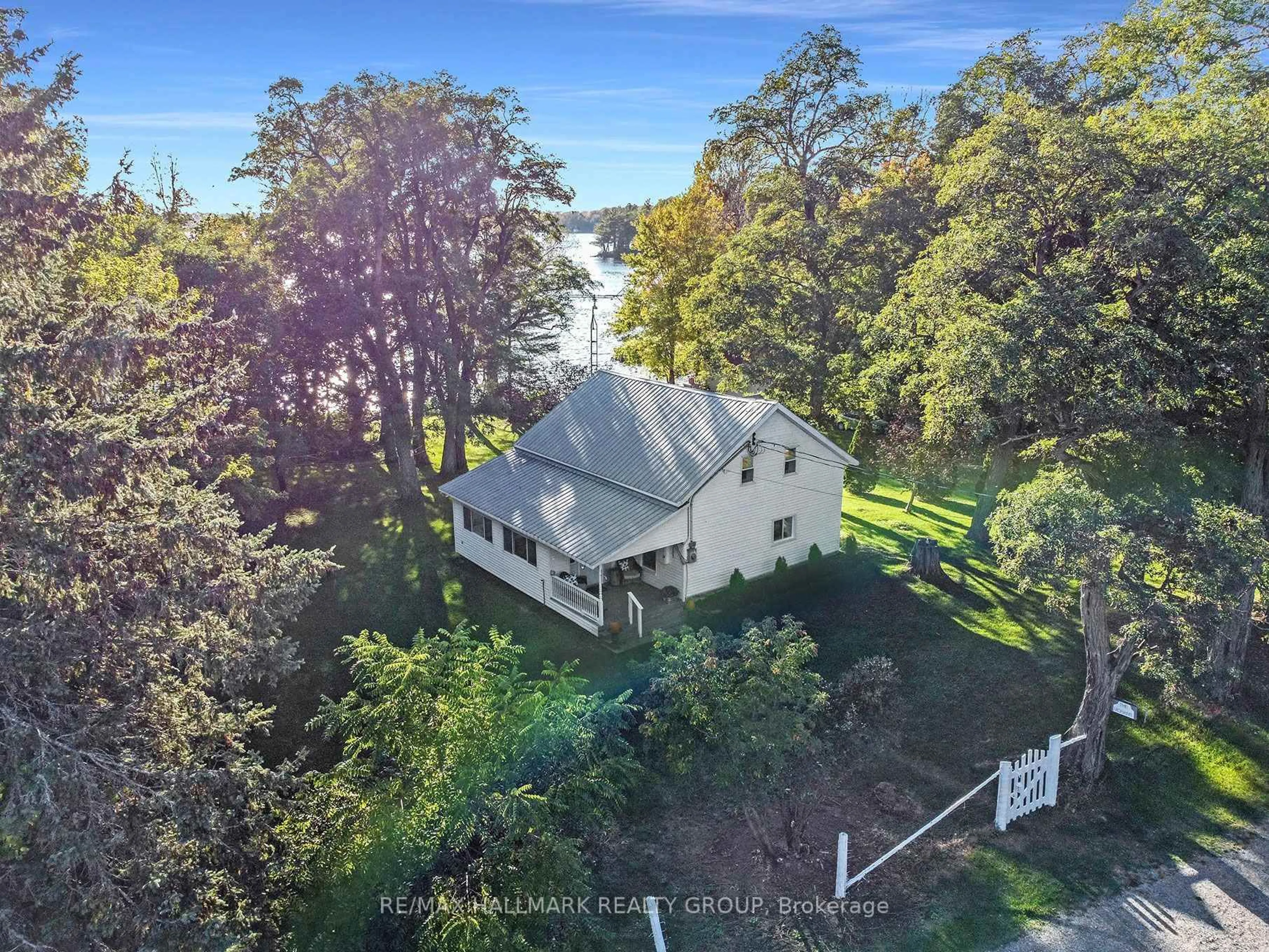 A pic from outside/outdoor area/front of a property/back of a property/a pic from drone, water/lake/river/ocean view for 80 R13 Rd, Rideau Lakes Ontario K0G 1L0