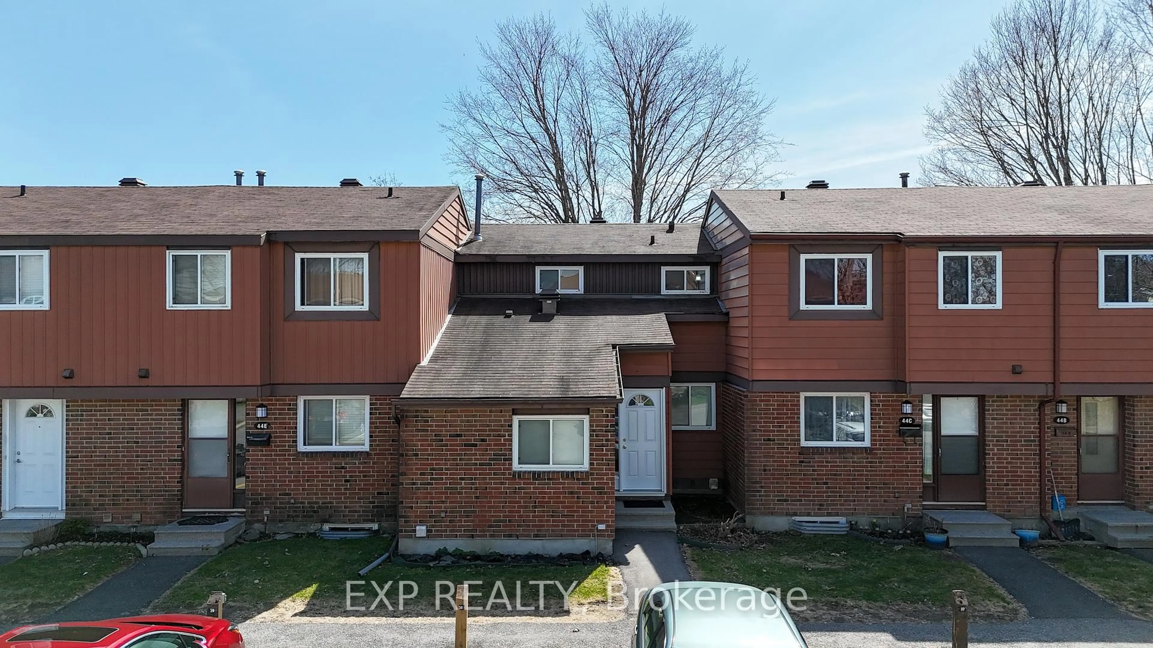 A pic from outside/outdoor area/front of a property/back of a property/a pic from drone, street for 44 FOXFIELD Dr #D, Ottawa Ontario K2J 1P7
