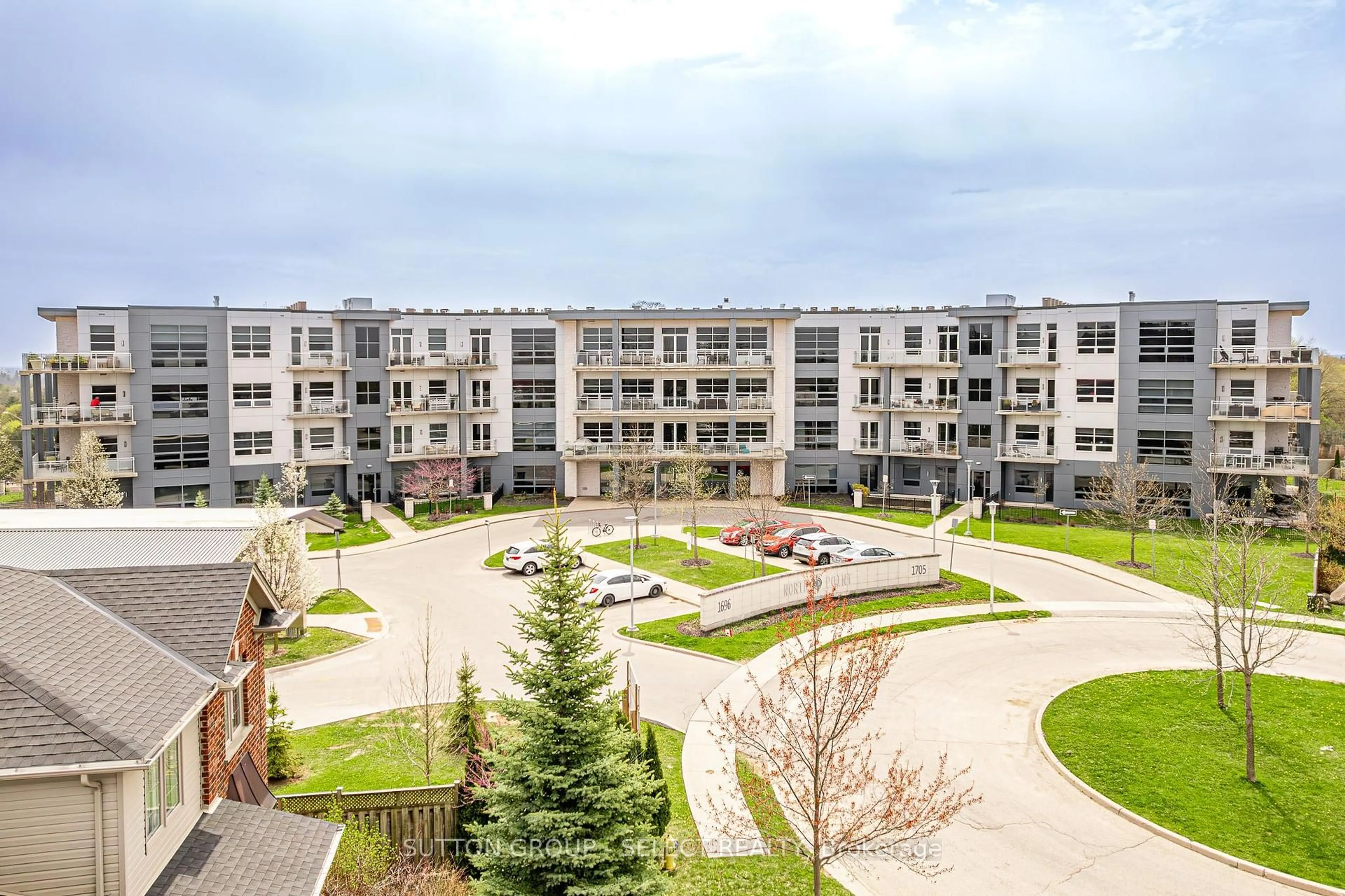 A pic from outside/outdoor area/front of a property/back of a property/a pic from drone, unknown for 1705 Fiddlehead Pl #307, London North Ontario N6G 0S1