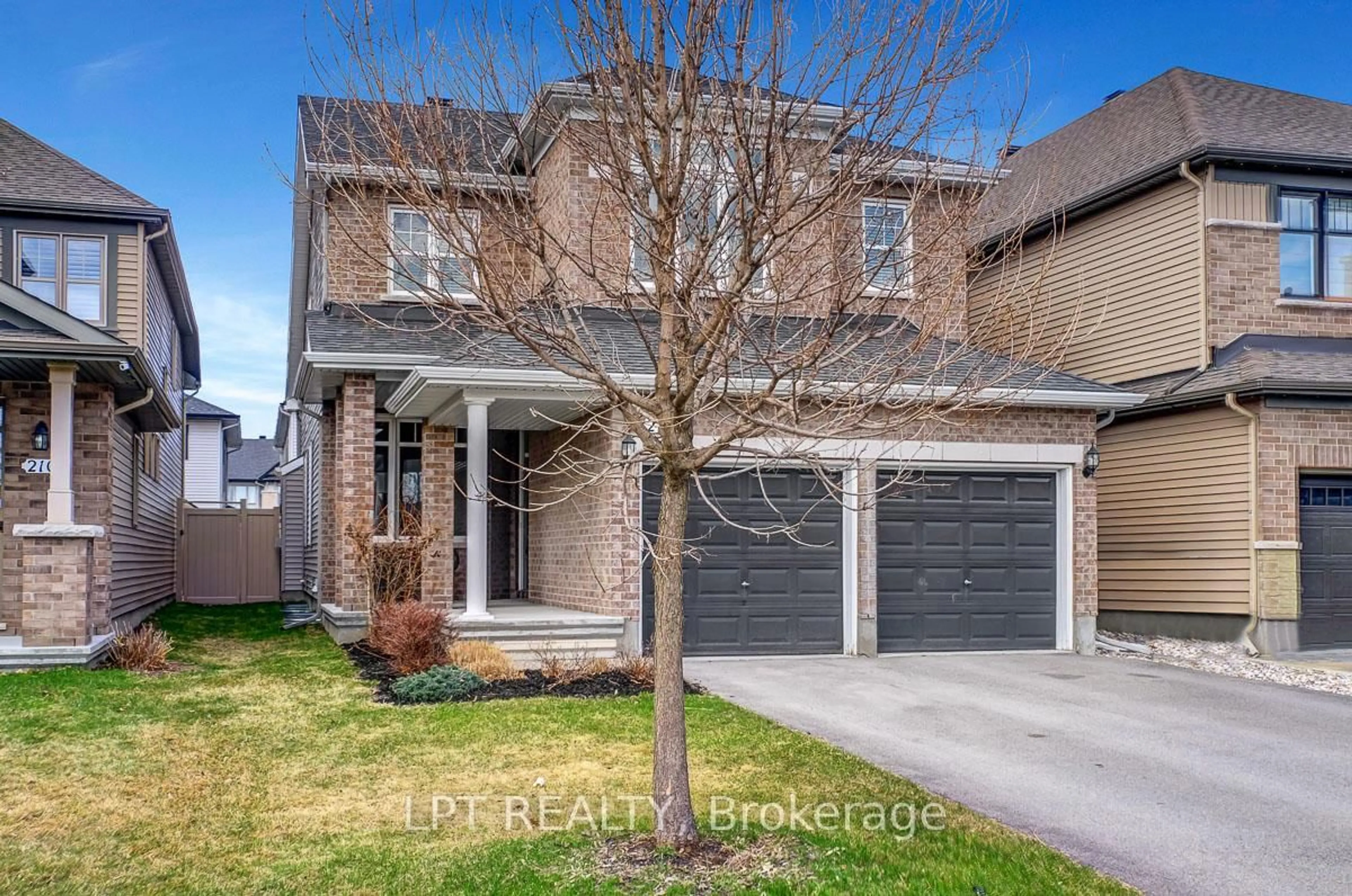 Home with brick exterior material, street for 214 Shinleaf Cres, Ottawa Ontario K1W 0J2