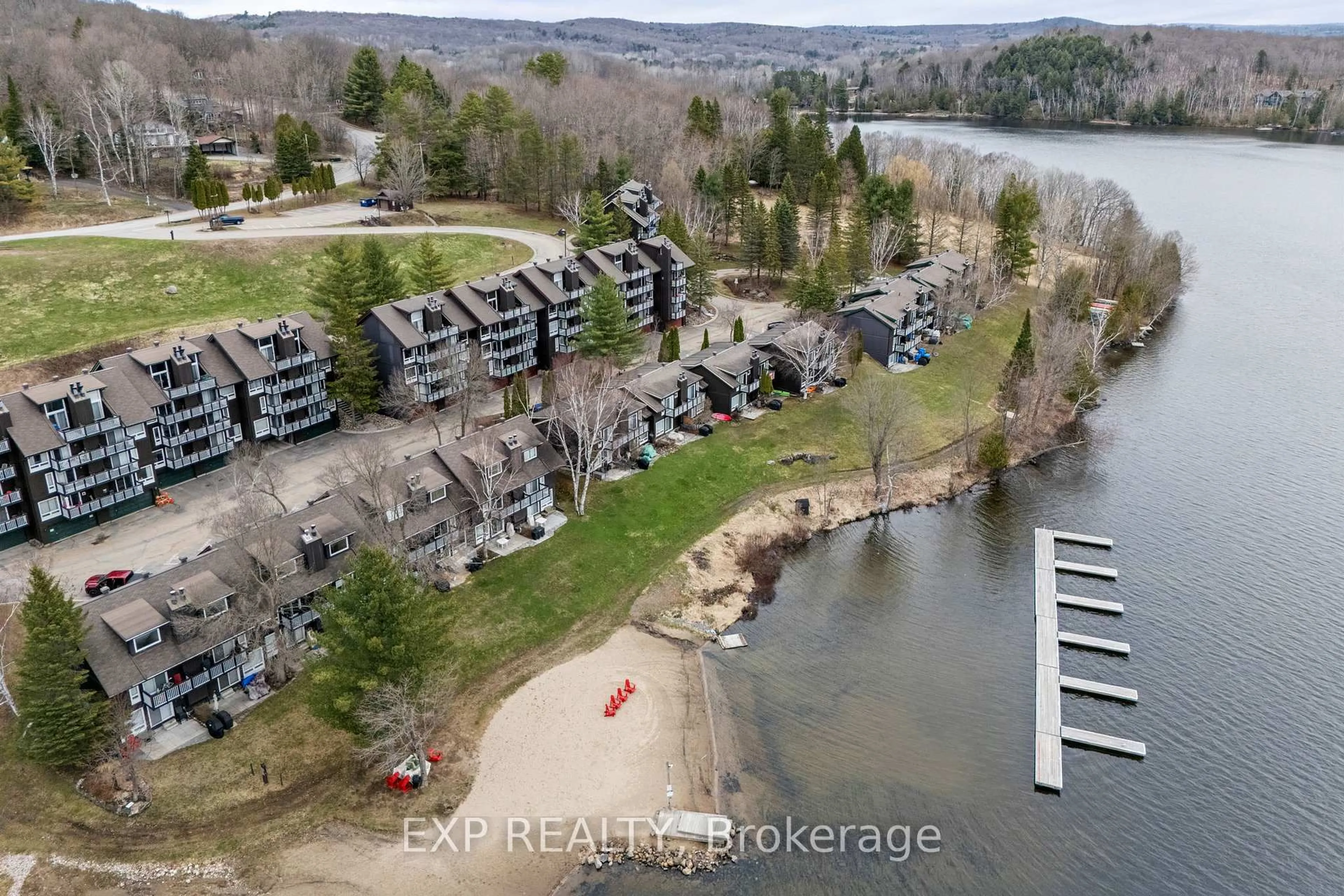 A pic from outside/outdoor area/front of a property/back of a property/a pic from drone, water/lake/river/ocean view for 12 Turner Dr #6, Huntsville Ontario P1H 1A8