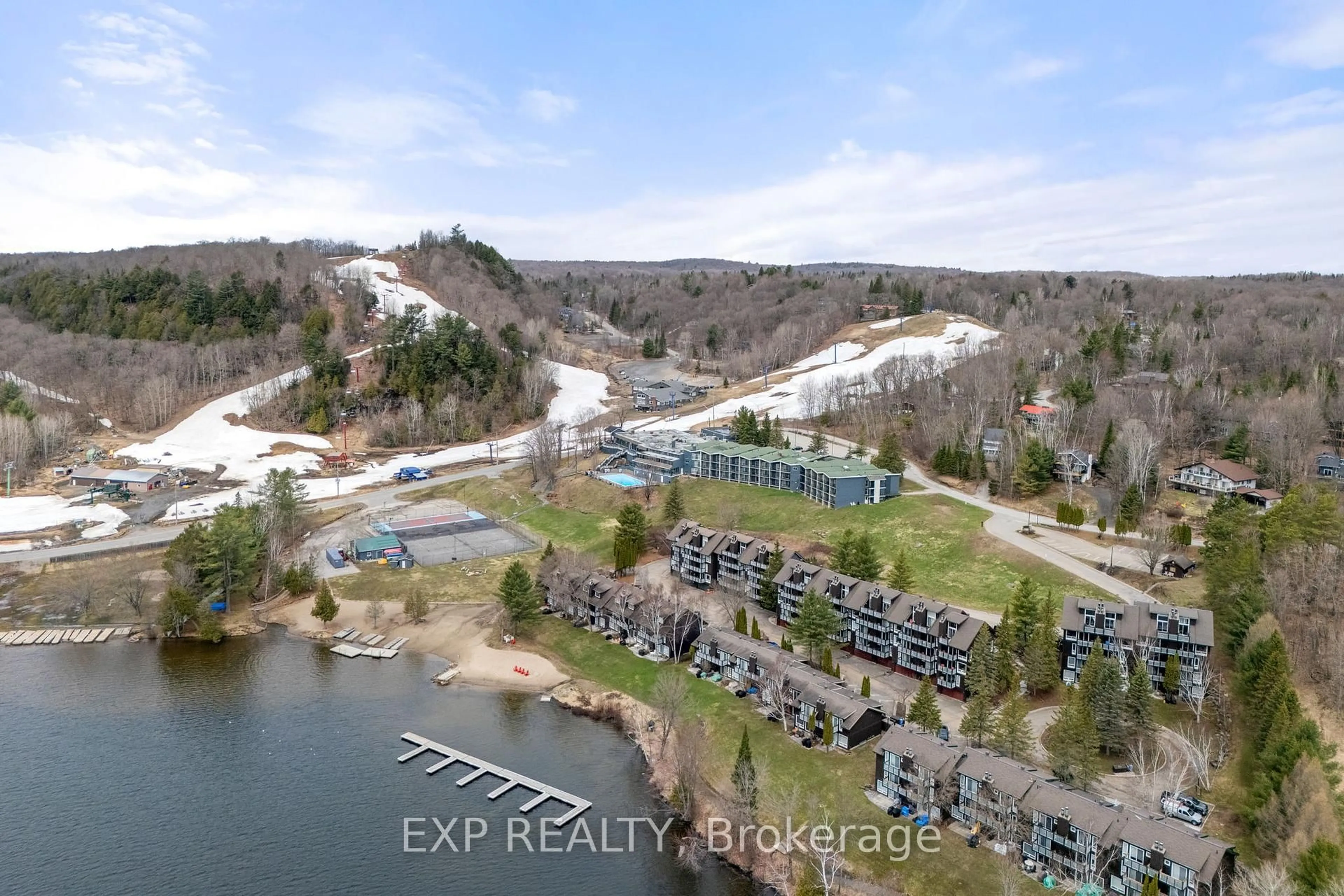 A pic from outside/outdoor area/front of a property/back of a property/a pic from drone, water/lake/river/ocean view for 12 Turner Dr #6, Huntsville Ontario P1H 1A8