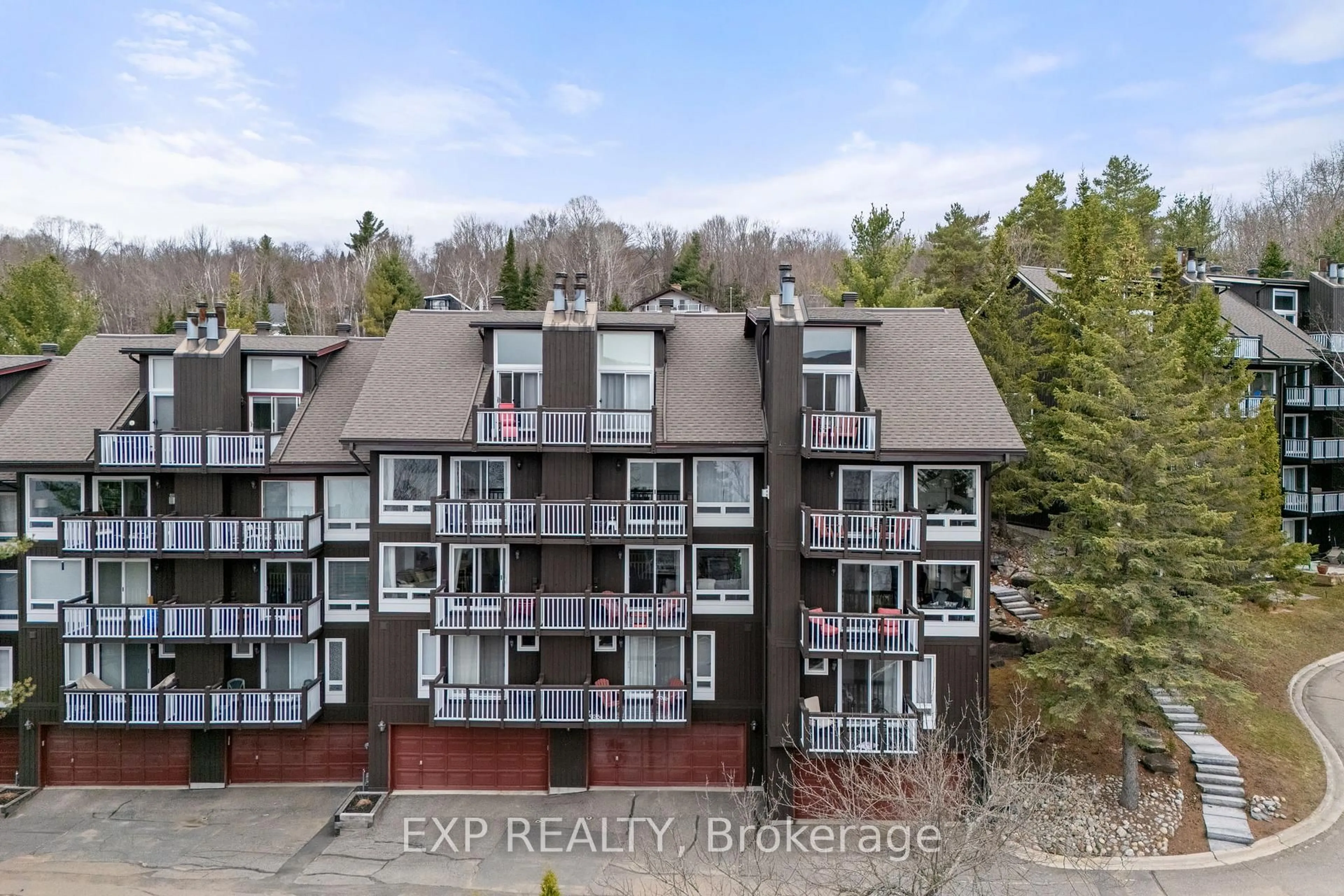 A pic from outside/outdoor area/front of a property/back of a property/a pic from drone, unknown for 12 Turner Dr #6, Huntsville Ontario P1H 1A8
