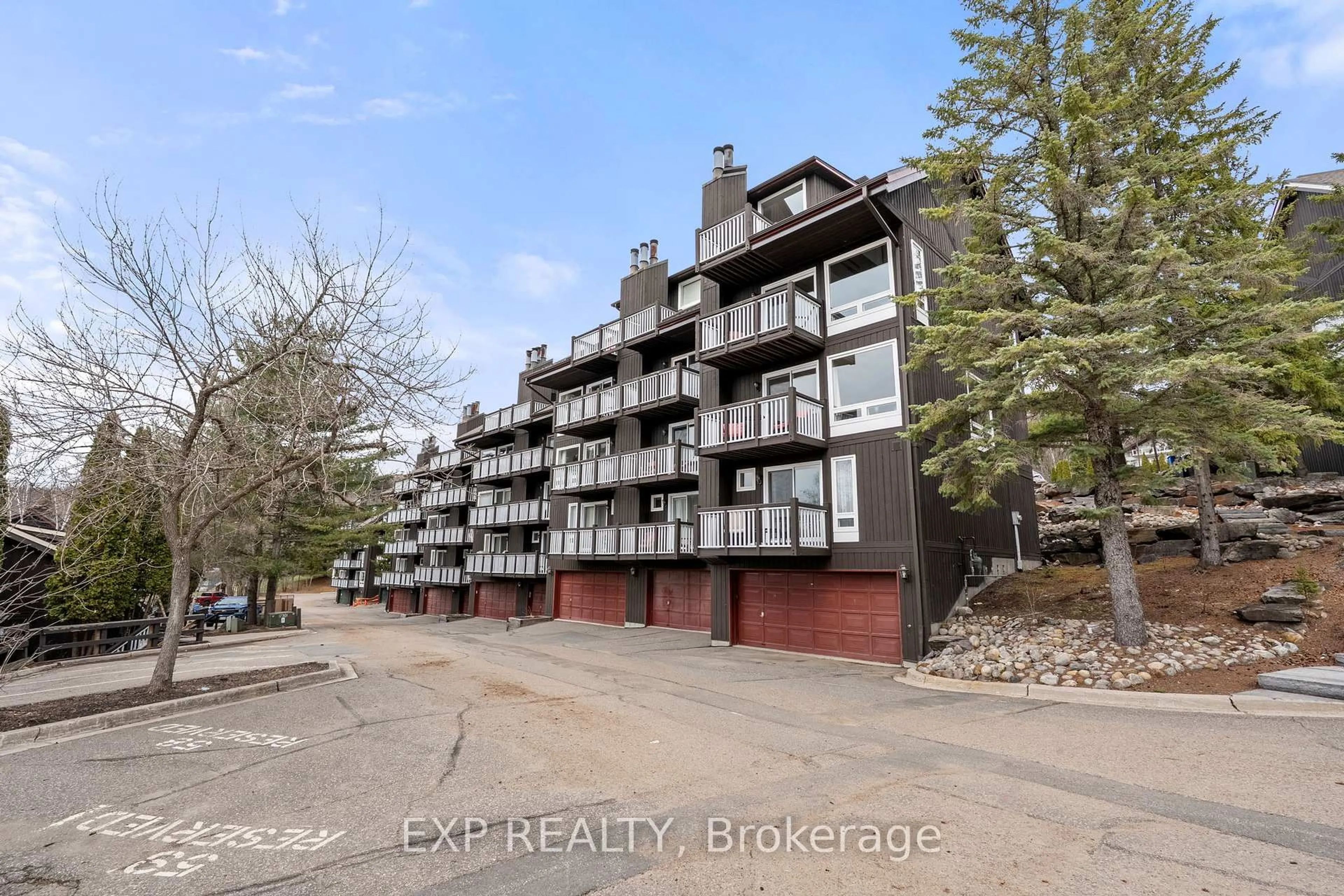 A pic from outside/outdoor area/front of a property/back of a property/a pic from drone, unknown for 12 Turner Dr #6, Huntsville Ontario P1H 1A8