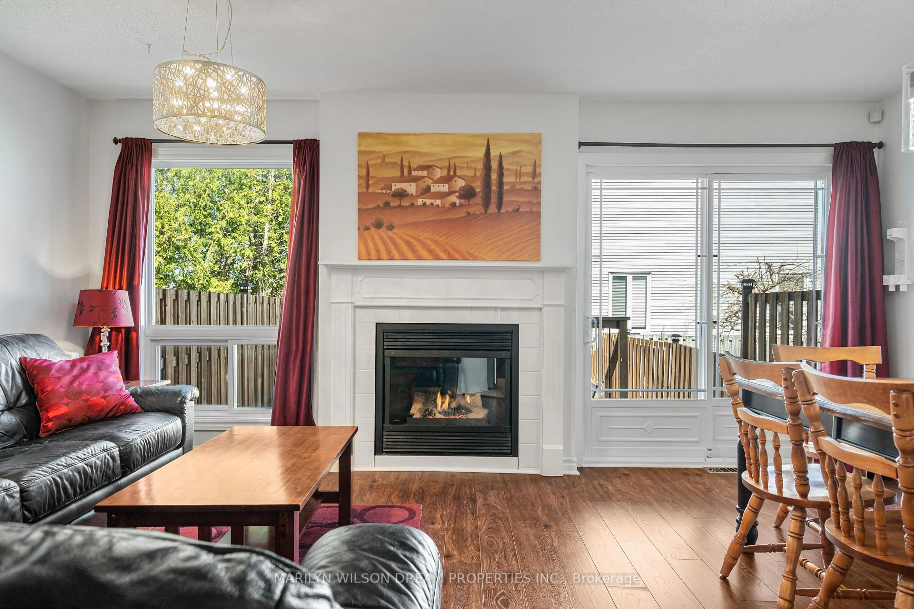 Living room with furniture, wood/laminate floor for 118 Halley St, Barrhaven Ontario K2J 3R9