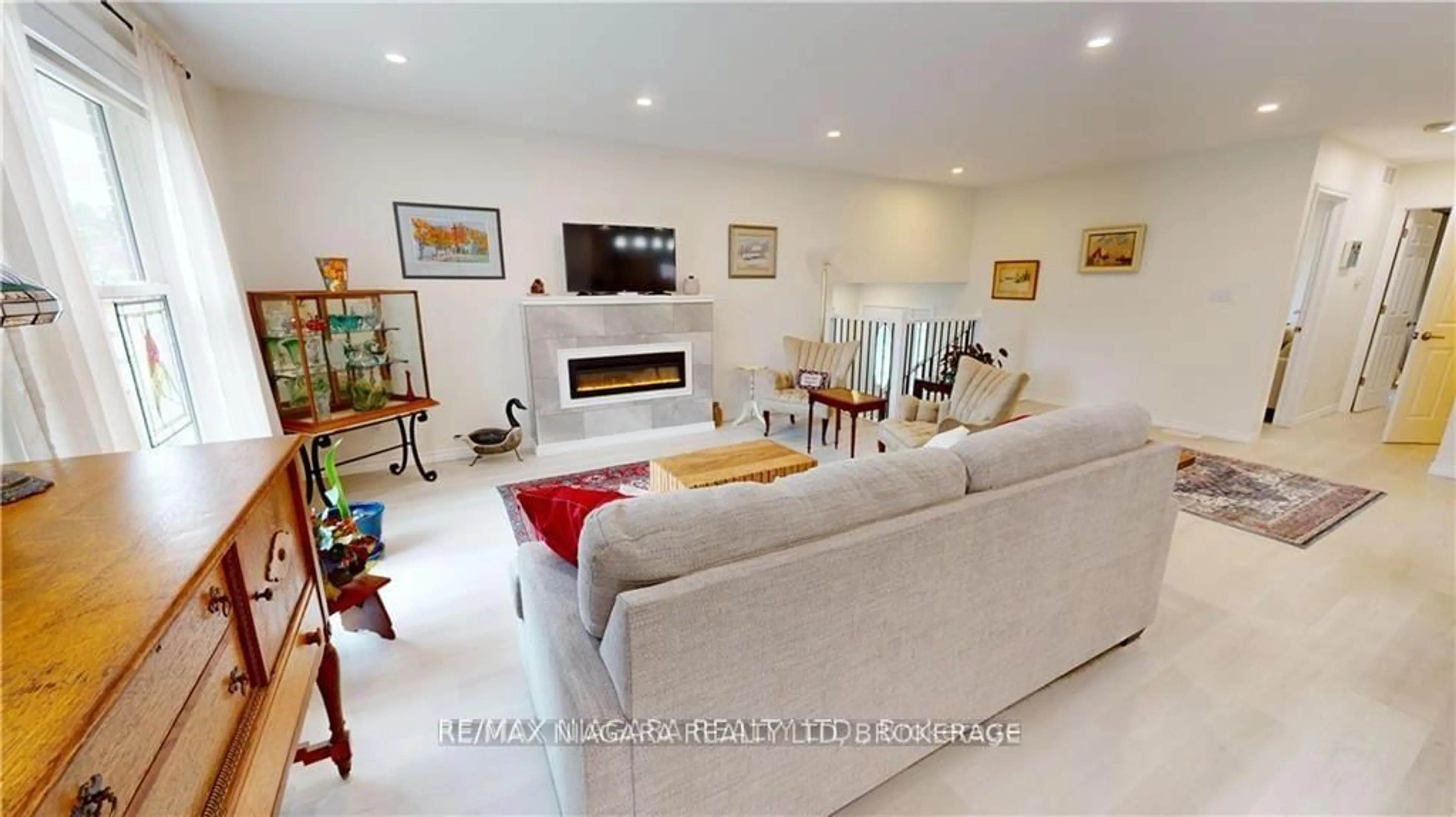 Living room with furniture, ceramic/tile floor for 84 Ziraldo Rd, St. Catharines Ontario L2N 6T1