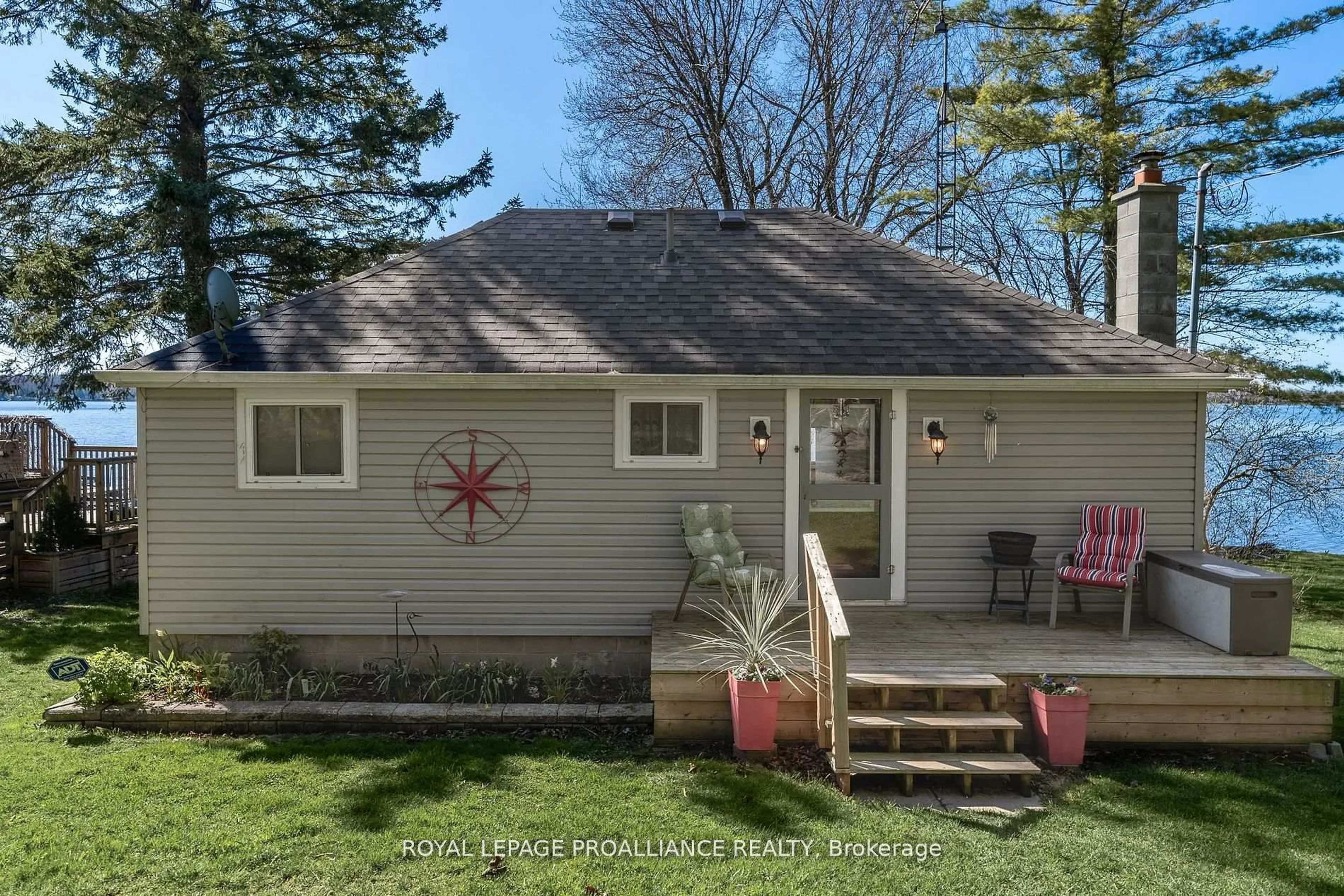 Home with vinyl exterior material, water/lake/river/ocean view for 1051 Lakeside Dr, Prince Edward County Ontario K0K 1T0