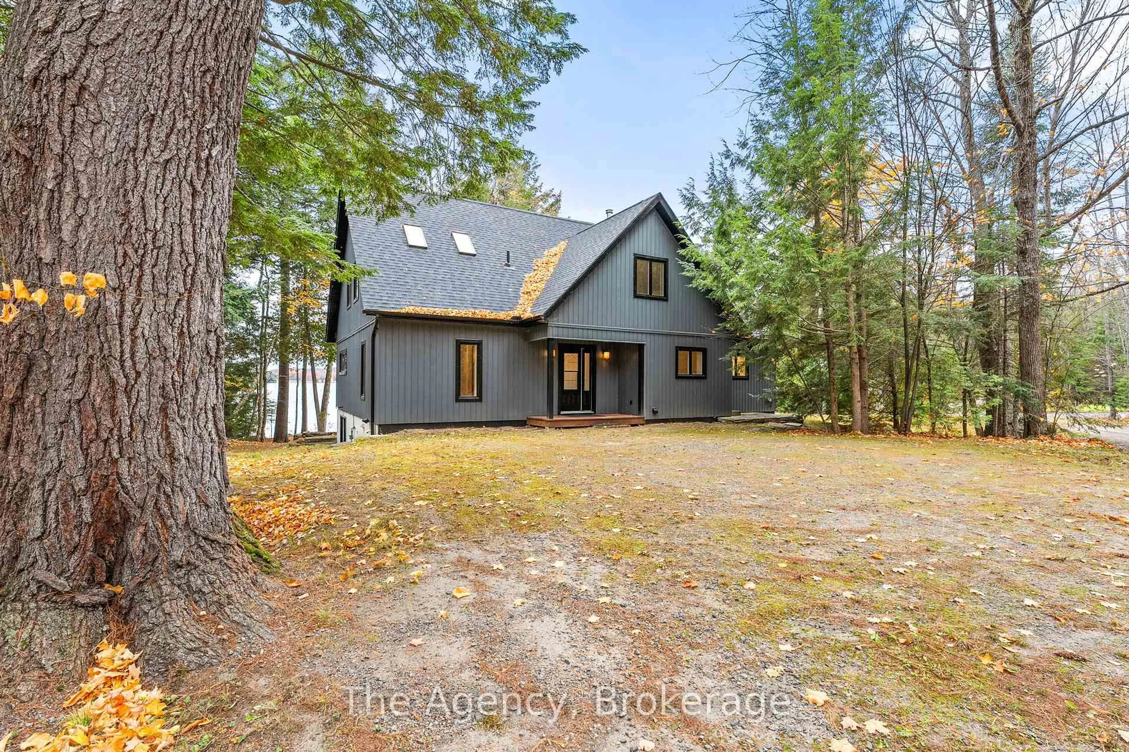 A pic from outside/outdoor area/front of a property/back of a property/a pic from drone, forest/trees view for 1009 Scotts Boathouse Rd, Lake of Bays Ontario P0B 1A0