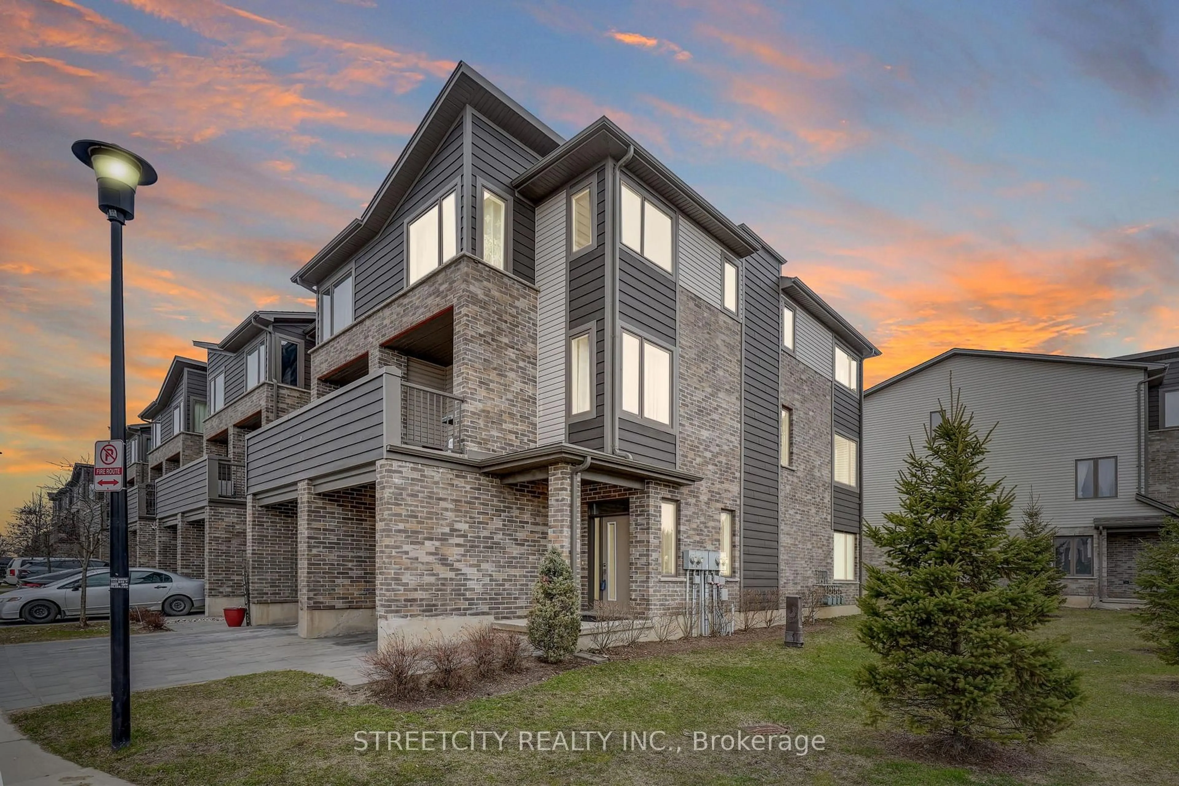 A pic from outside/outdoor area/front of a property/back of a property/a pic from drone, street for 2070 Meadowgate Blvd #1, London South Ontario N6M 0H5
