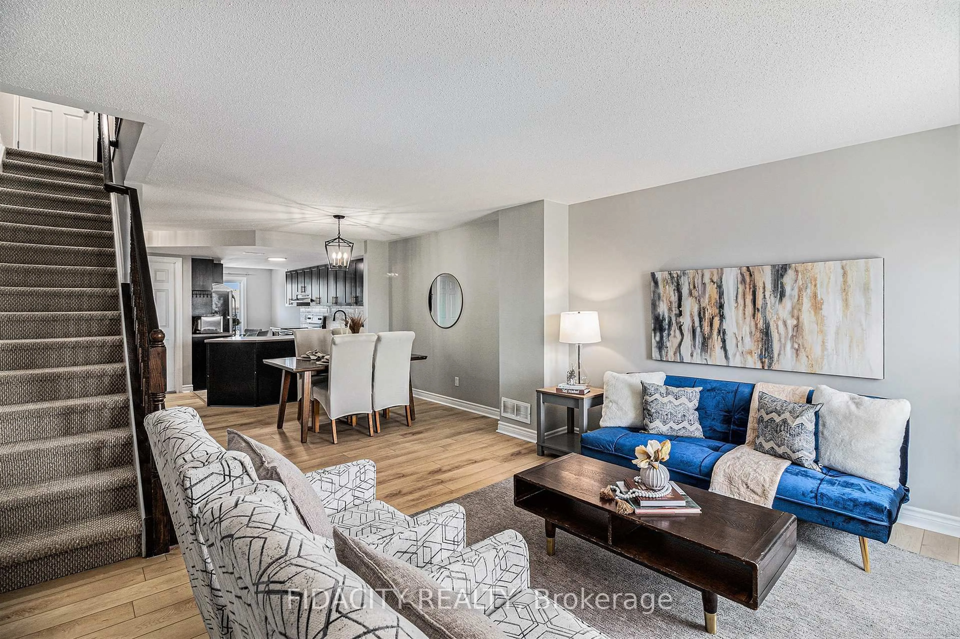 Living room with furniture, wood/laminate floor for 711 Lakeridge Dr #3, Ottawa Ontario K4A 0N5
