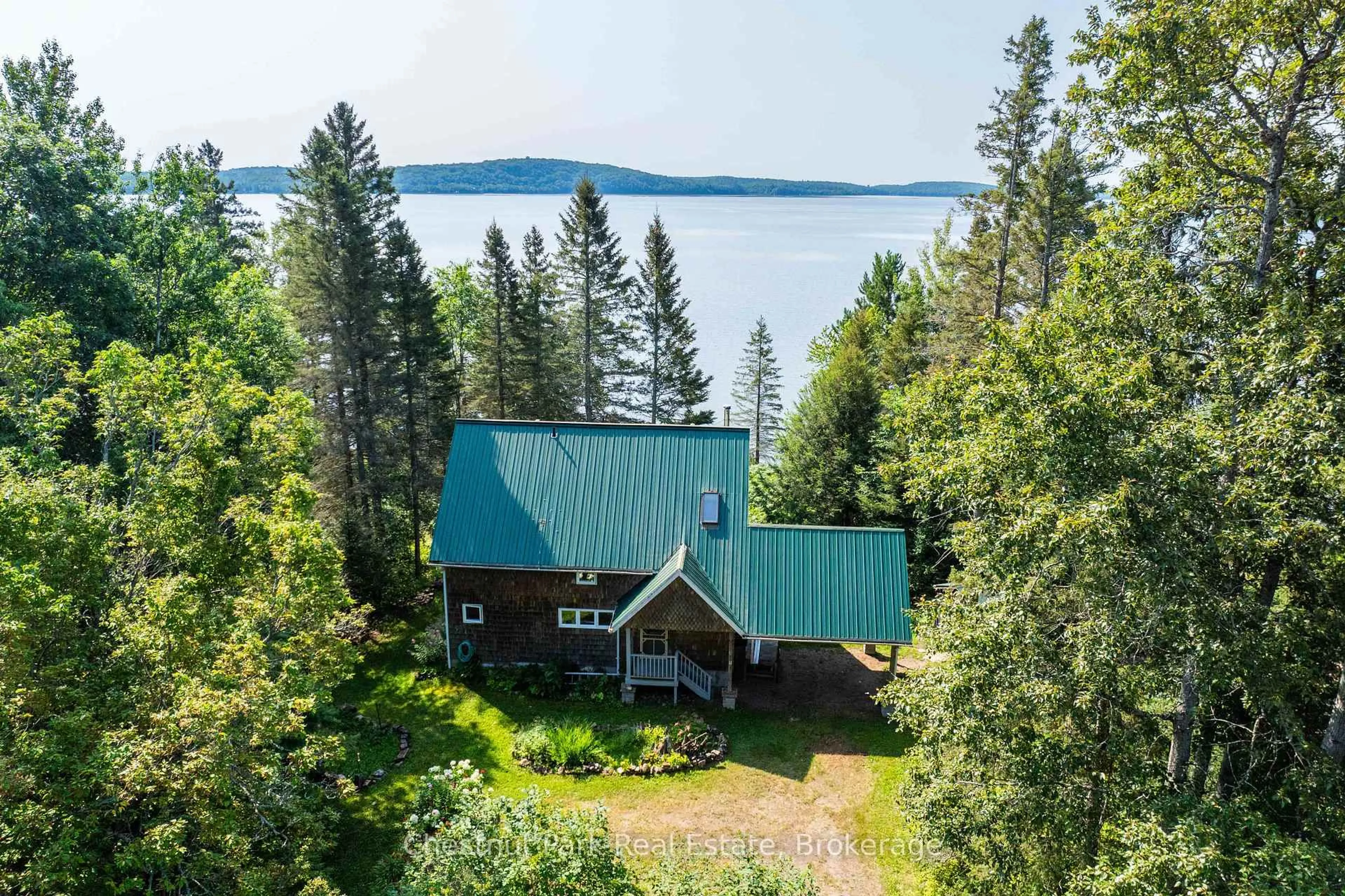 A pic from outside/outdoor area/front of a property/back of a property/a pic from drone, water/lake/river/ocean view for 1 & 5 Barrie St, Sundridge Ontario P0A 1Z0