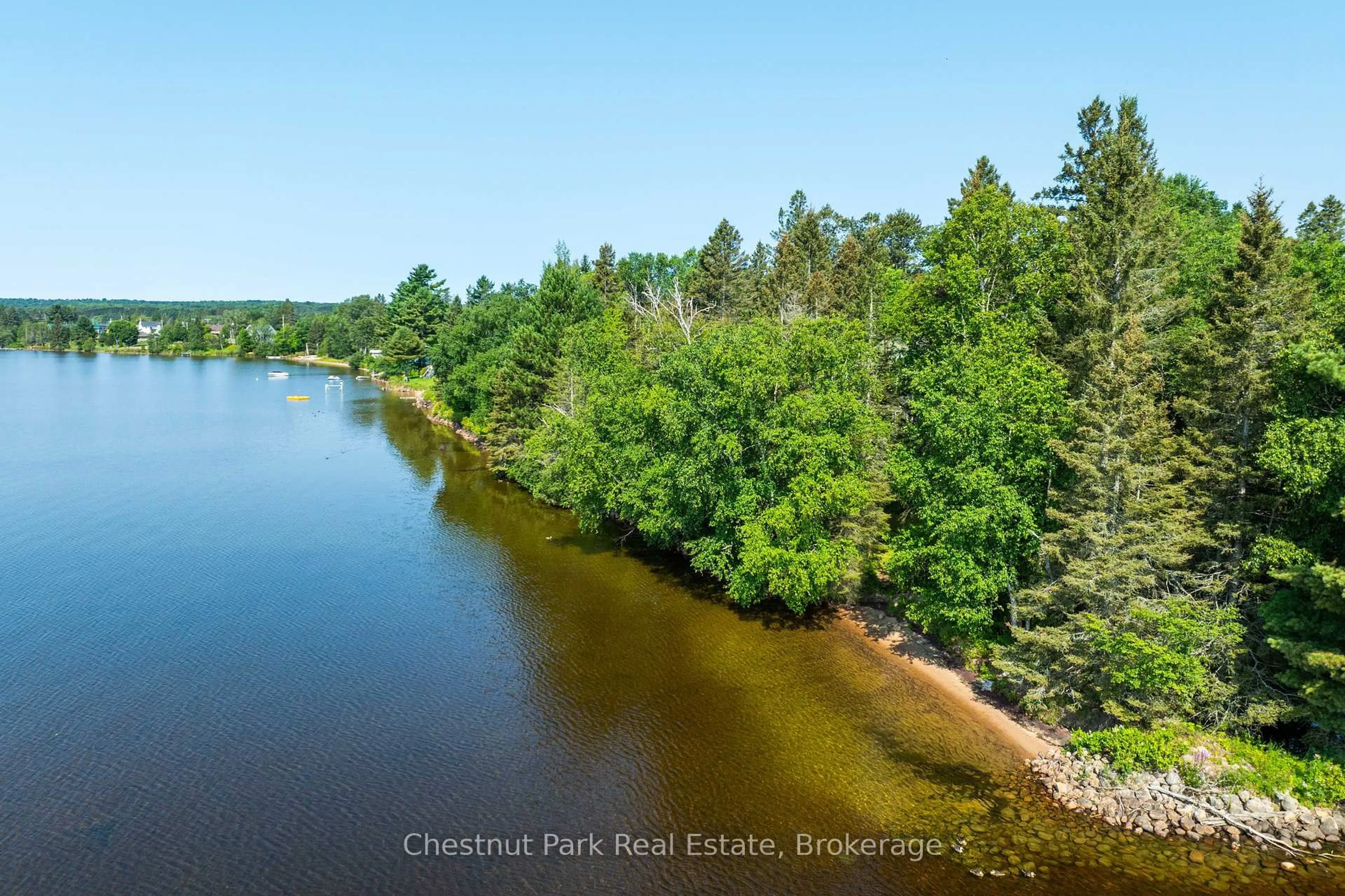 A pic from outside/outdoor area/front of a property/back of a property/a pic from drone, water/lake/river/ocean view for 1 & 5 Barrie St, Sundridge Ontario P0A 1Z0