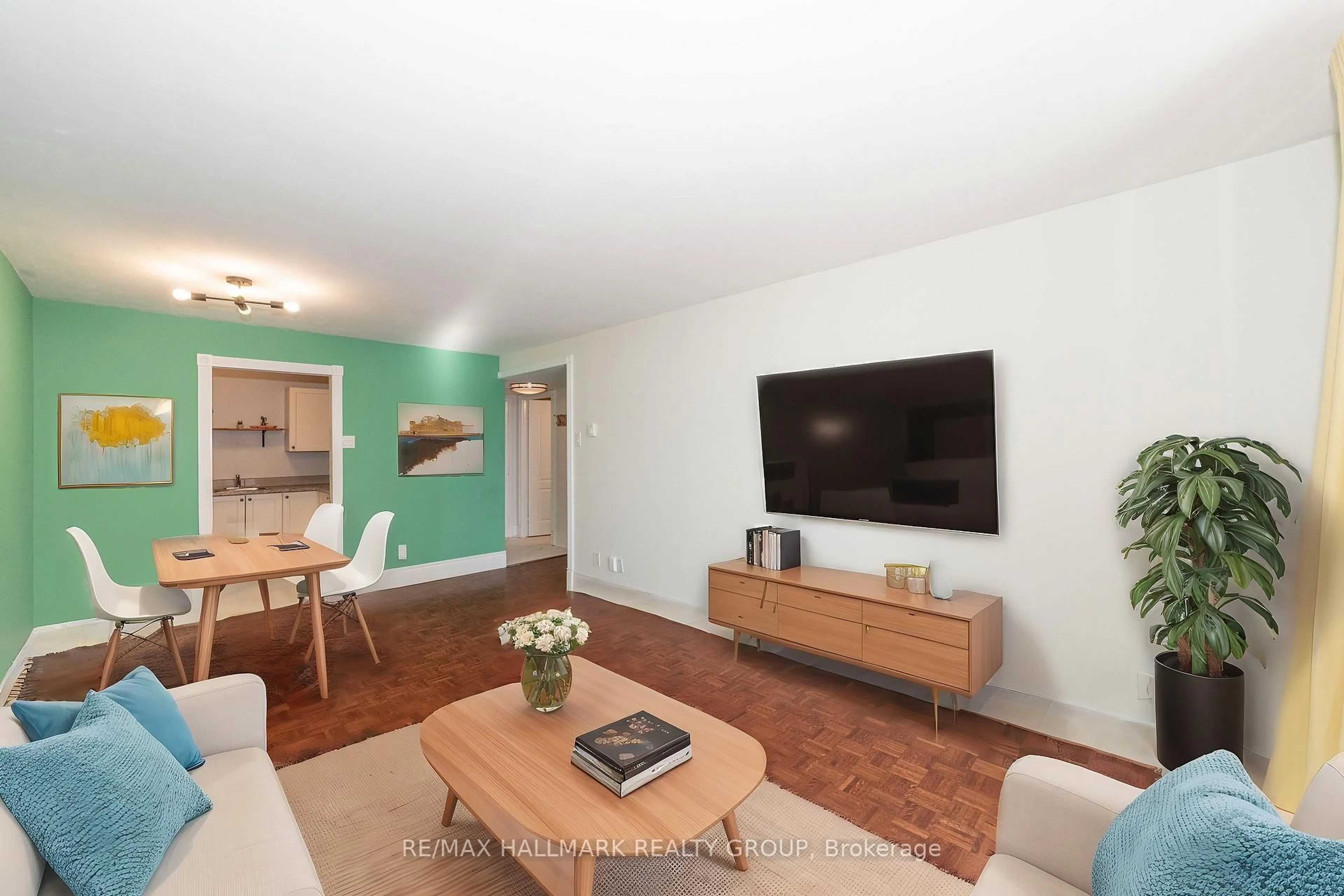 Living room with furniture, wood/laminate floor for 475 Laurier Ave #1006, Ottawa Ontario K1R 7X1