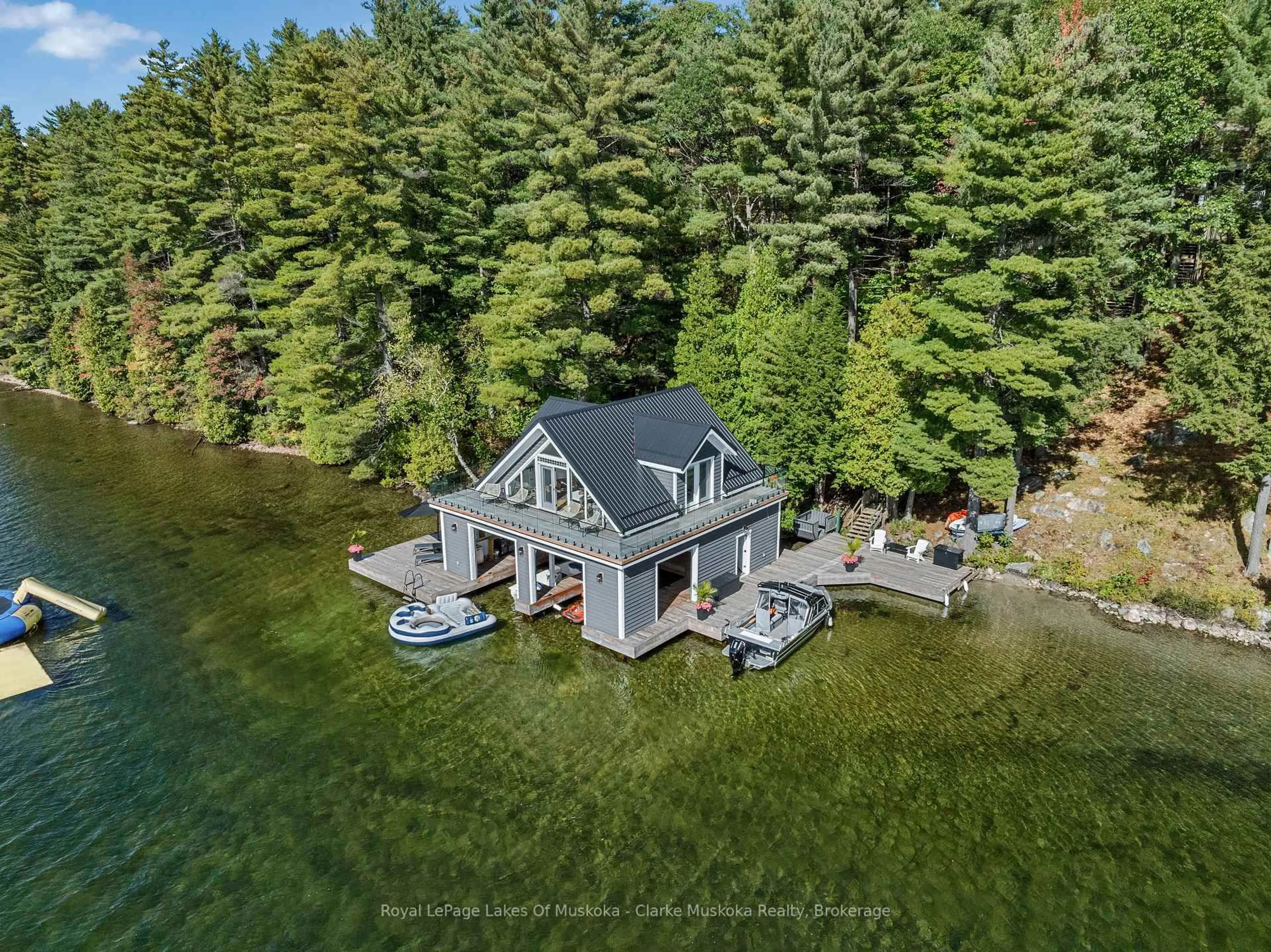 A pic from outside/outdoor area/front of a property/back of a property/a pic from drone, water/lake/river/ocean view for 22 PLAYFAIR Island #3, Seguin Ontario P0C 1H0