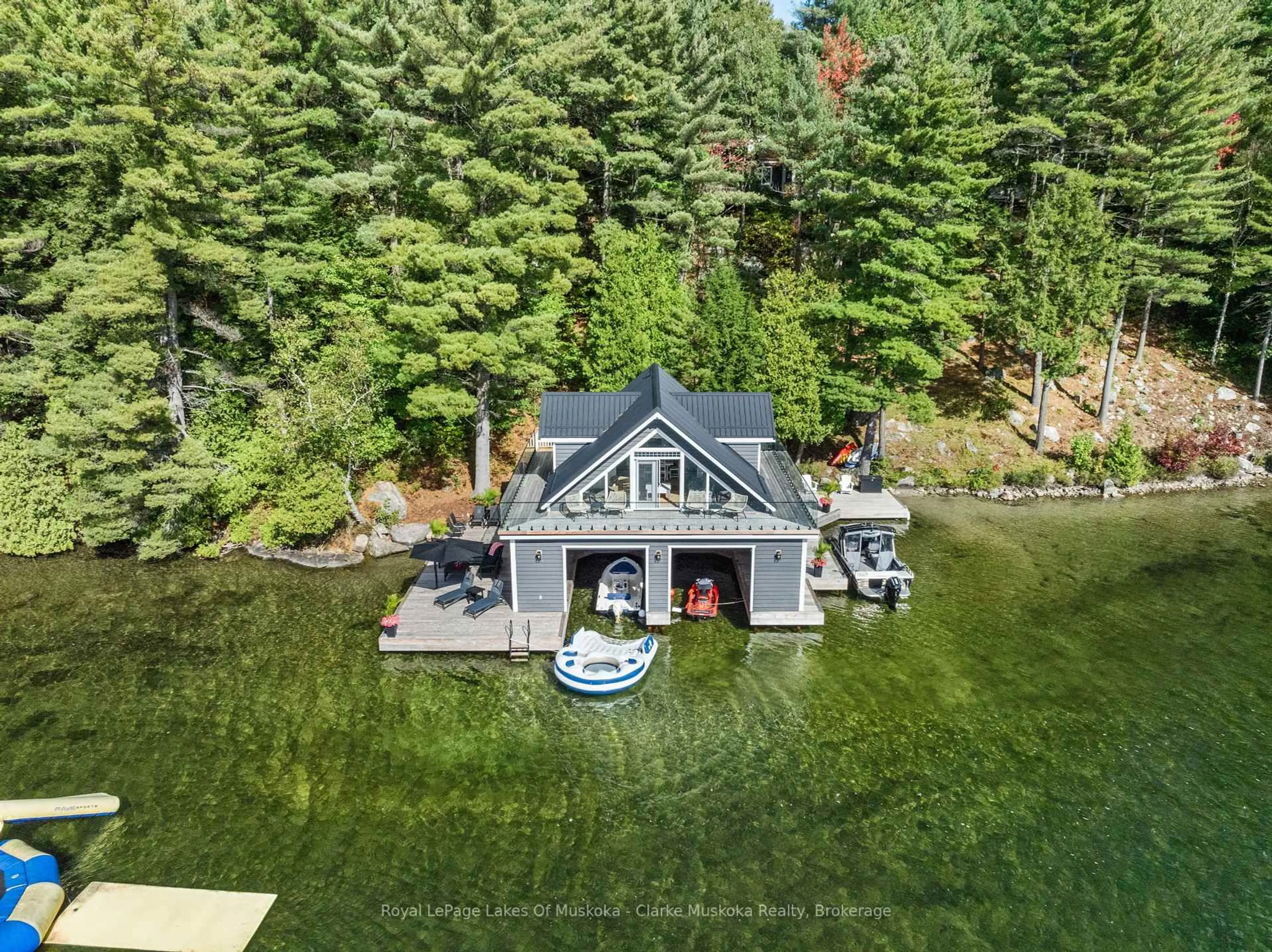 A pic from outside/outdoor area/front of a property/back of a property/a pic from drone, water/lake/river/ocean view for 22 PLAYFAIR Island #3, Seguin Ontario P0C 1H0