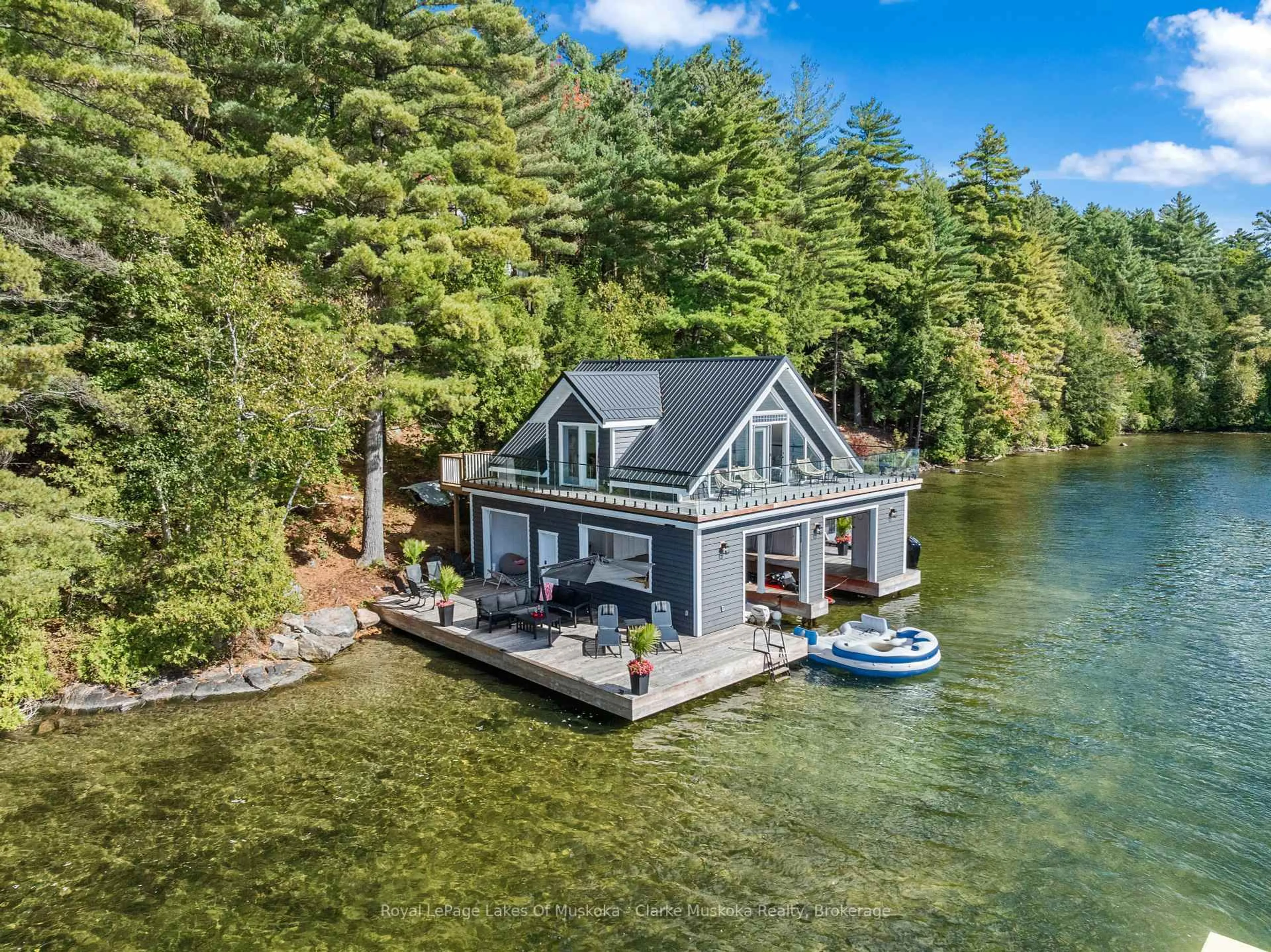 A pic from outside/outdoor area/front of a property/back of a property/a pic from drone, water/lake/river/ocean view for 22 PLAYFAIR Island #3, Seguin Ontario P0C 1H0