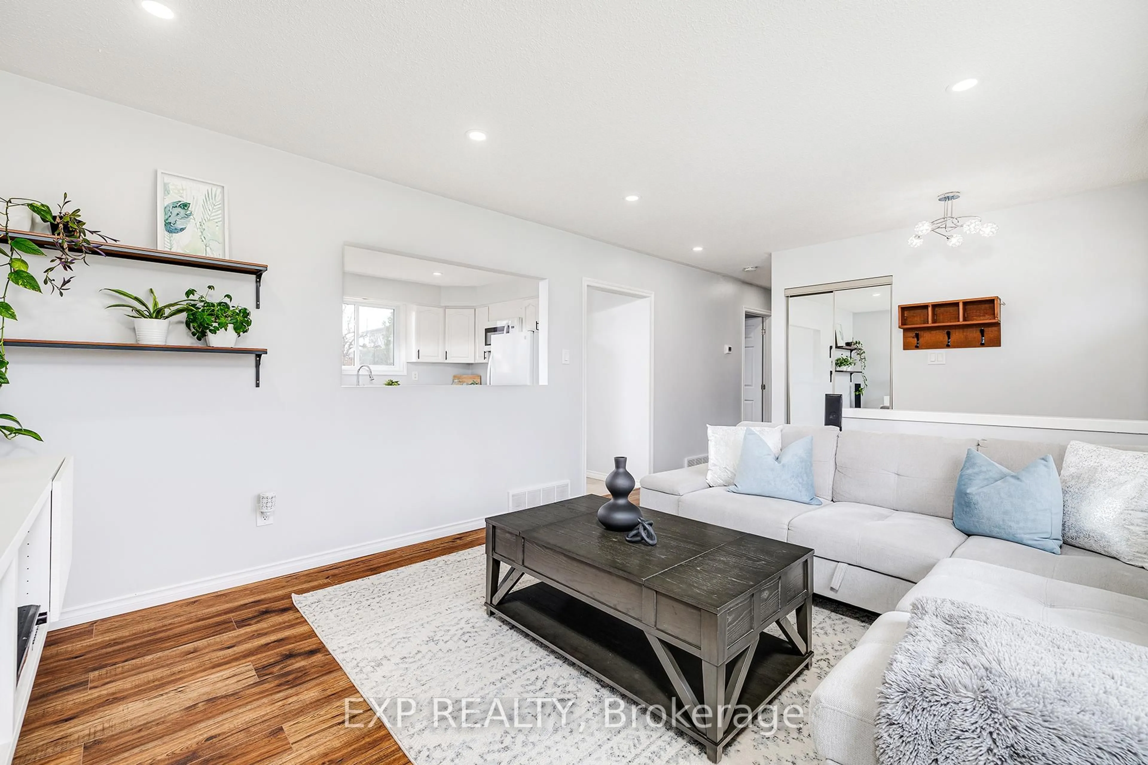 Living room with furniture, wood/laminate floor for 1005 Mary Ave, Cambridge Ontario N3H 4N6