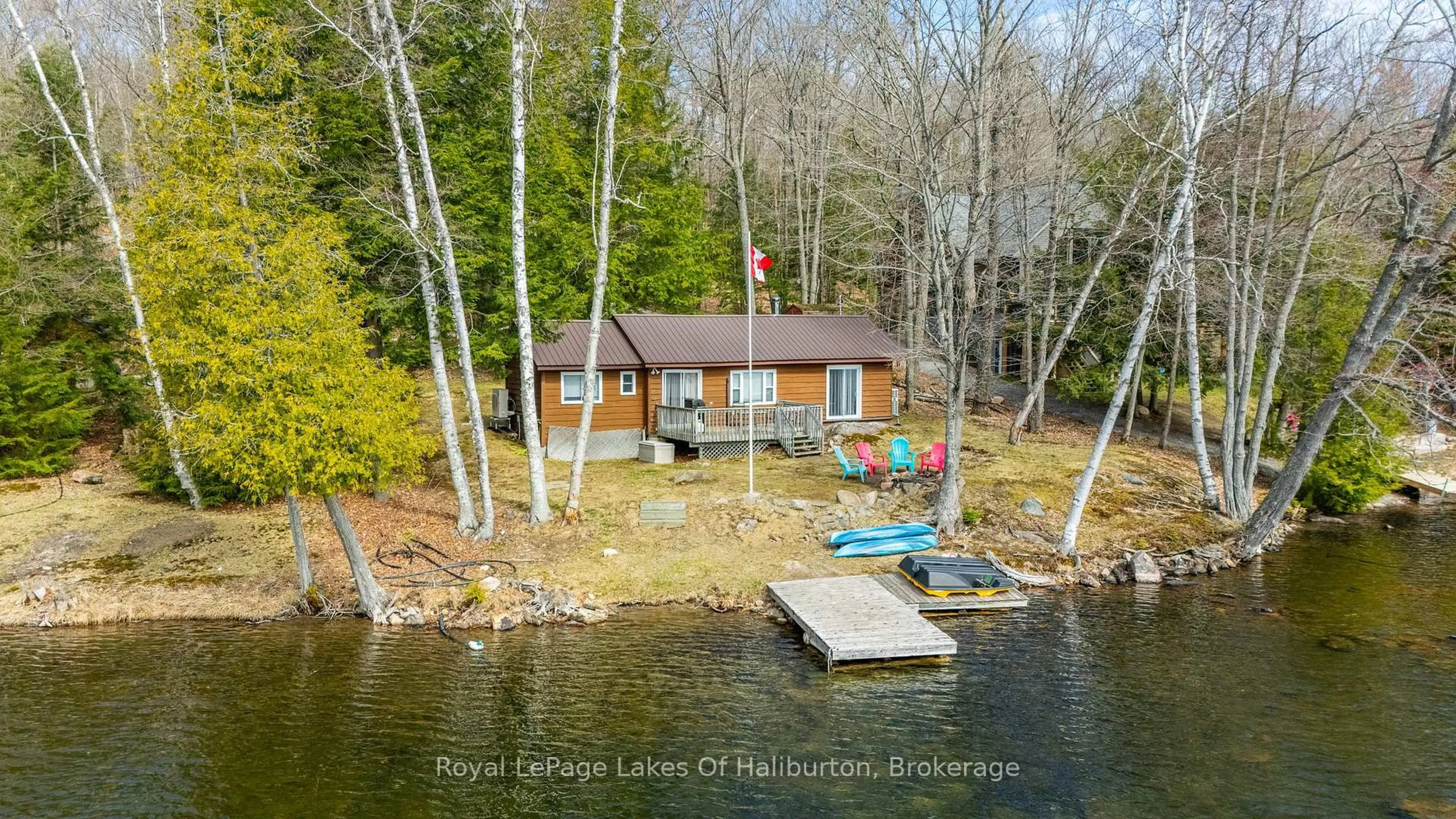 A pic from outside/outdoor area/front of a property/back of a property/a pic from drone, water/lake/river/ocean view for 1216 Lake Lorraine Rd, Highlands East Ontario K0L 2Y0
