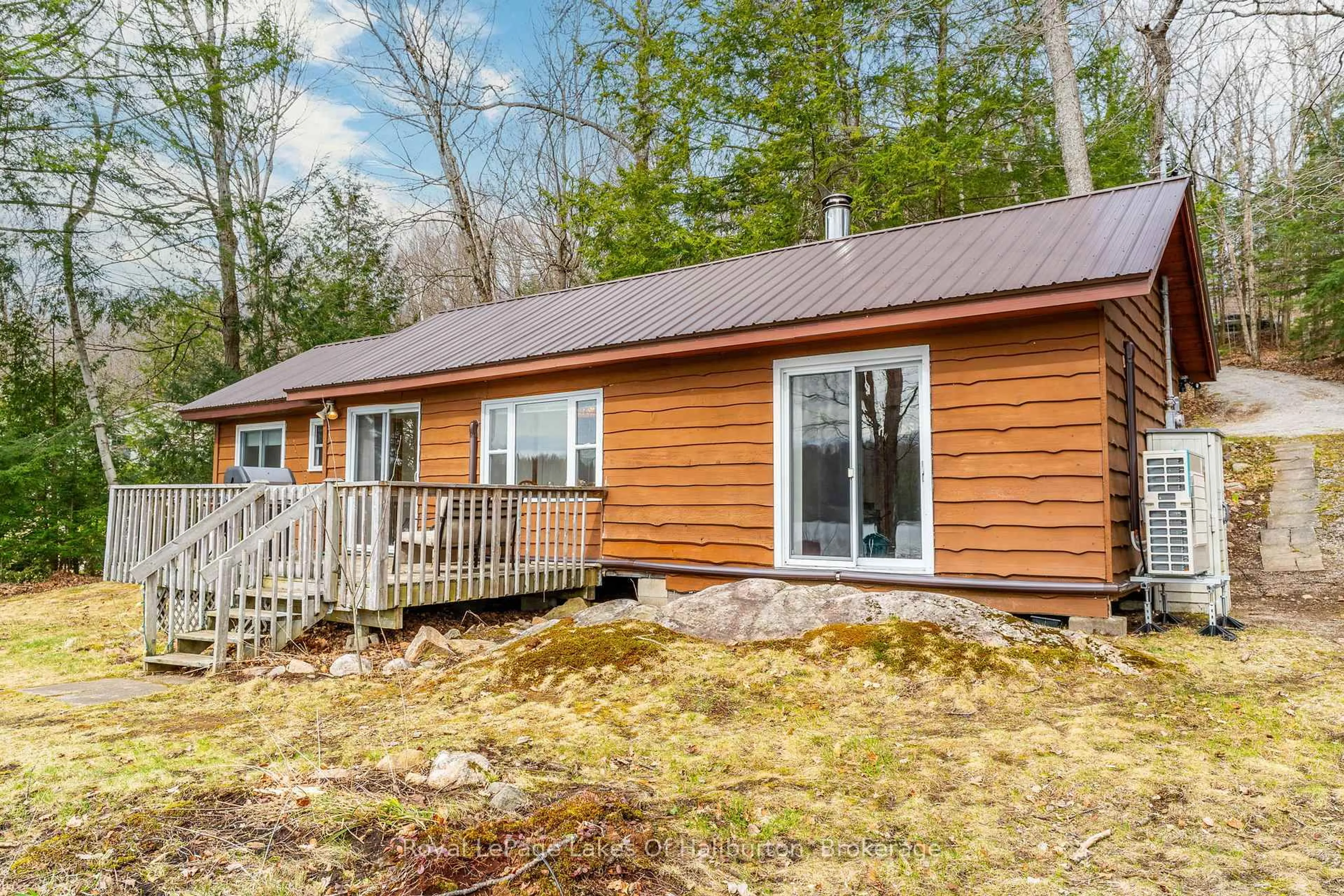 Home with vinyl exterior material, water/lake/river/ocean view for 1216 Lake Lorraine Rd, Highlands East Ontario K0L 2Y0