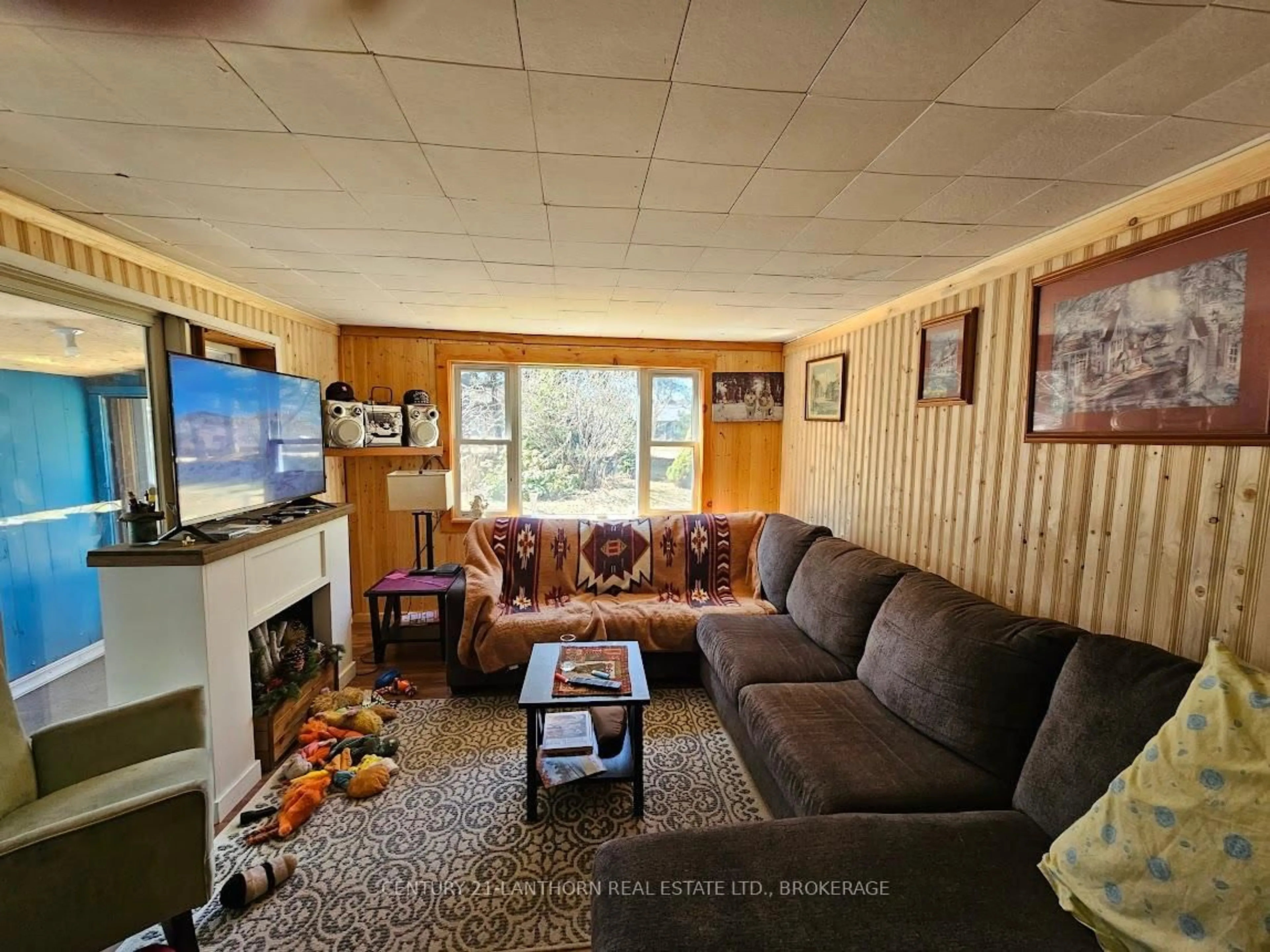 Living room with furniture, wood/laminate floor for 119 Addington rd 7 Rd, Denbigh Ontario K0H 1L0
