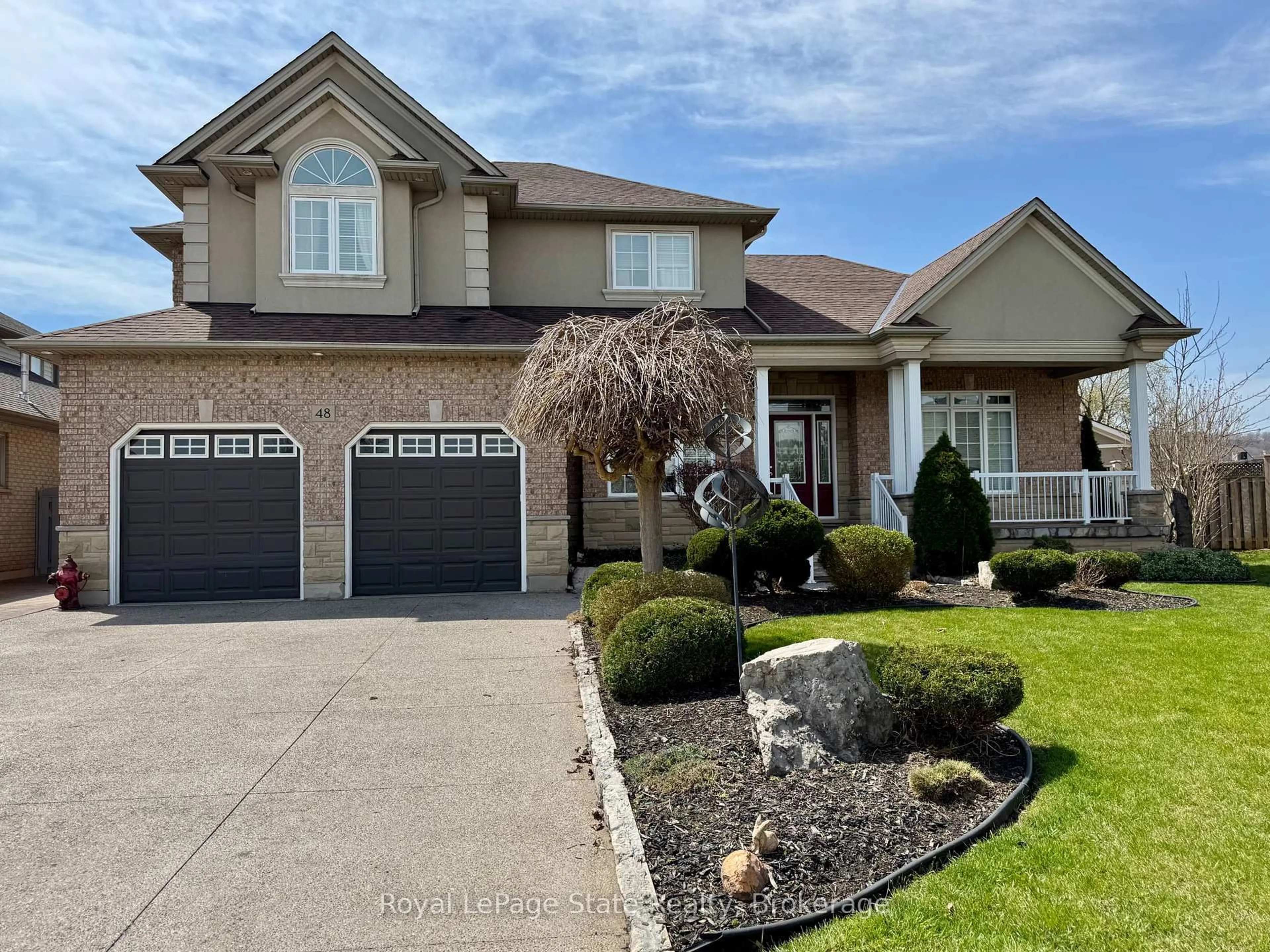 Home with brick exterior material, street for 48 Tuscani Dr, Hamilton Ontario L8E 5W4