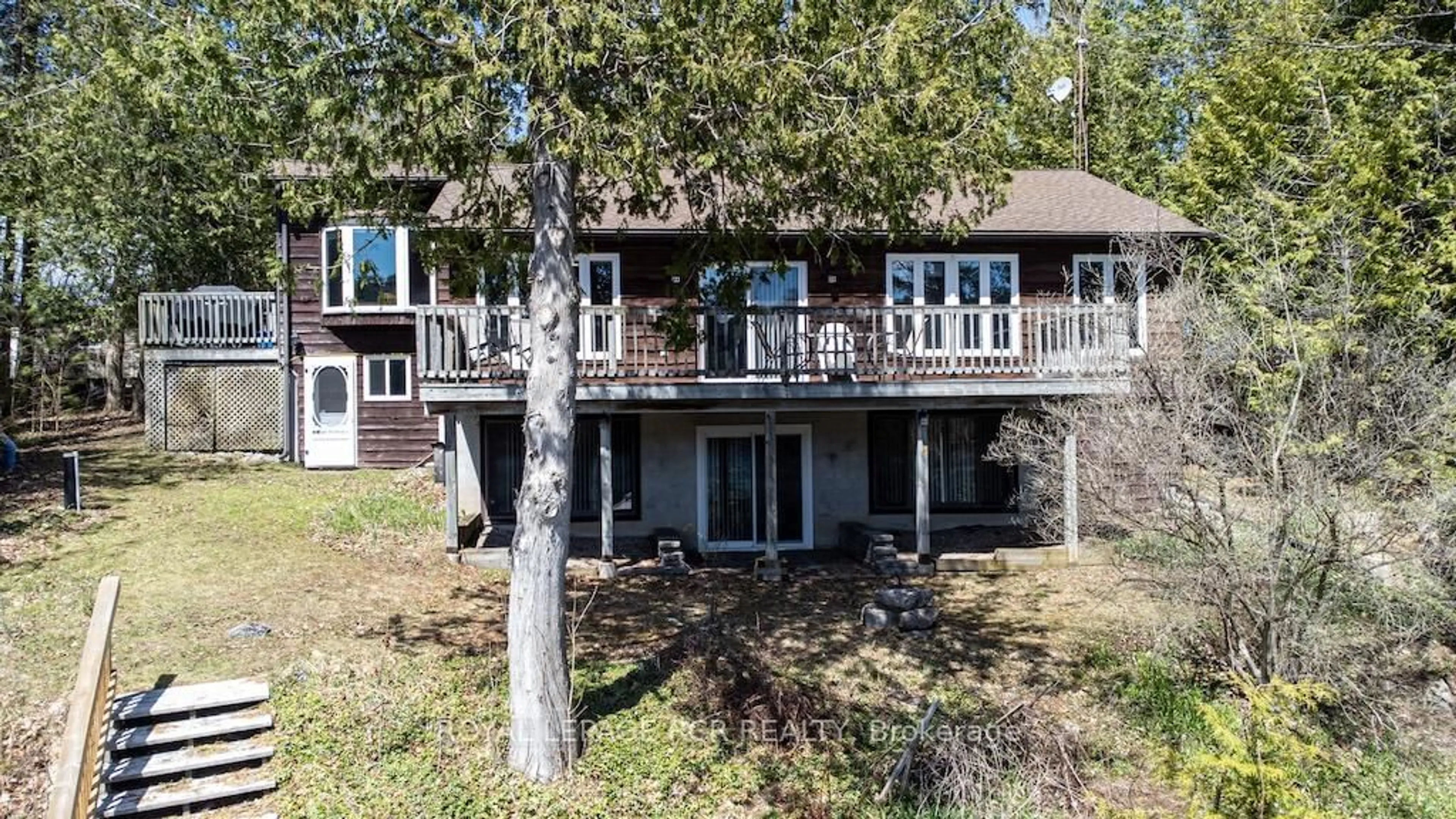 A pic from outside/outdoor area/front of a property/back of a property/a pic from drone, water/lake/river/ocean view for 24 Juniper Cres, Kawartha Lakes Ontario K0M 1C0
