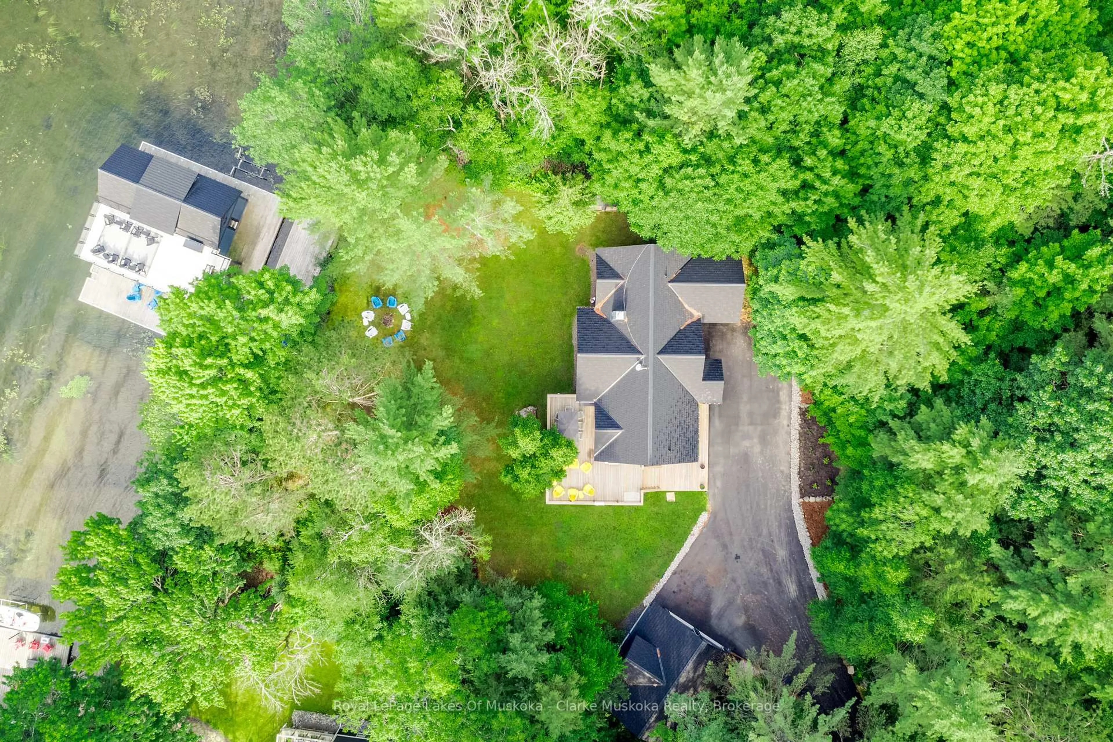 A pic from outside/outdoor area/front of a property/back of a property/a pic from drone, forest/trees view for 1298 Hemlock Point Rd, Muskoka Lakes Ontario P0B 1J0