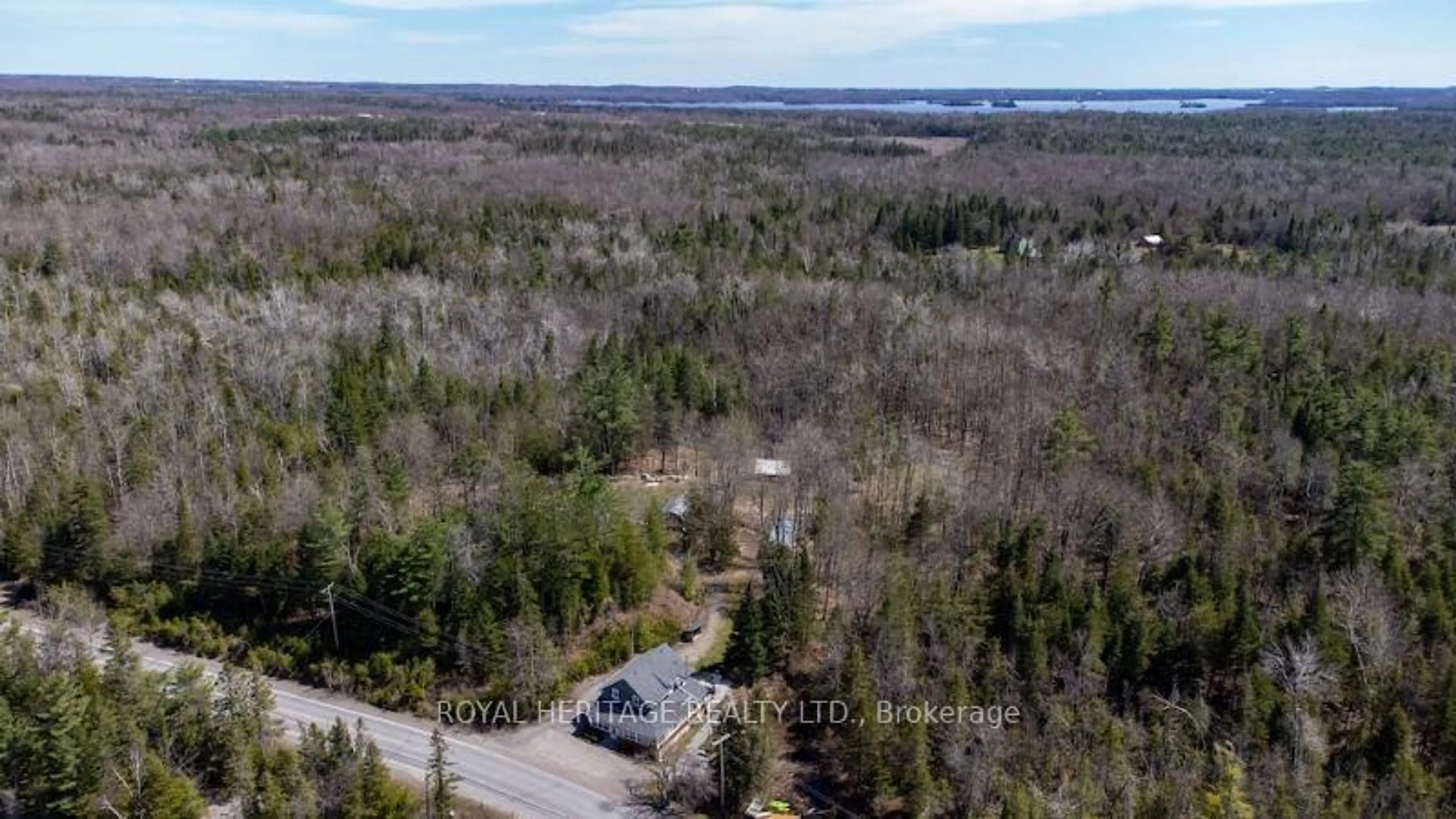 A pic from outside/outdoor area/front of a property/back of a property/a pic from drone, forest/trees view for 1074 Lakehurst Rd, Trent Lakes Ontario K0L 2H0
