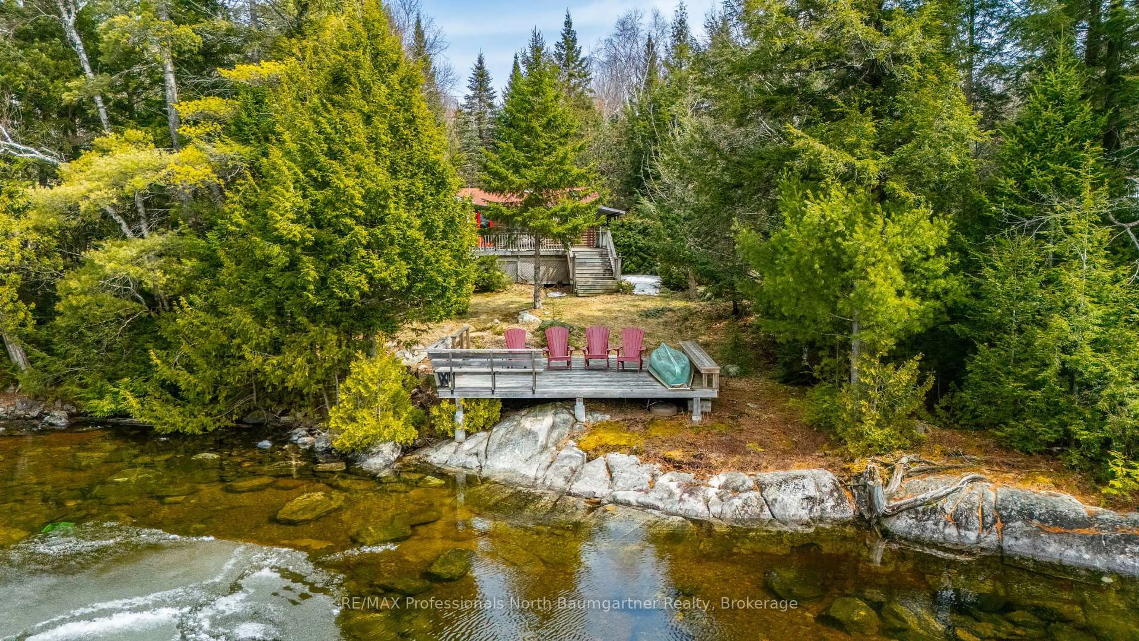A pic from outside/outdoor area/front of a property/back of a property/a pic from drone, water/lake/river/ocean view for 4957 Kennisis Lake Rd, Dysart et al Ontario K0M 1S0