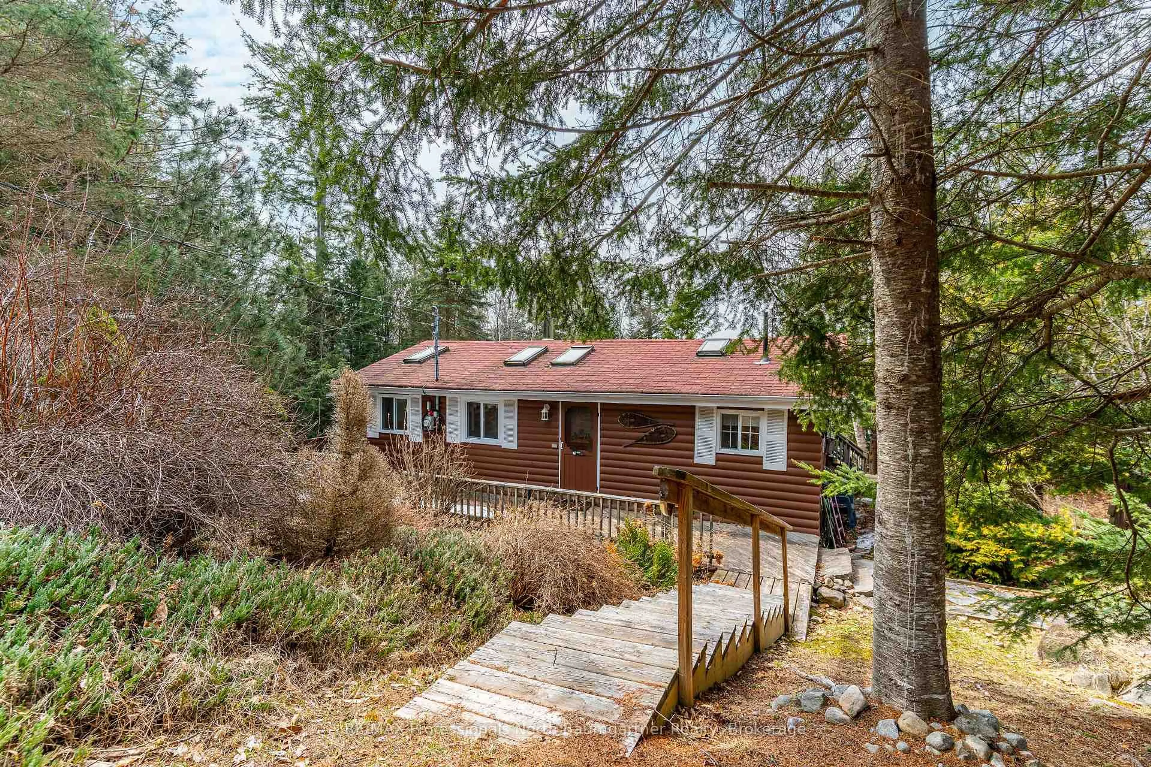 A pic from outside/outdoor area/front of a property/back of a property/a pic from drone, forest/trees view for 4957 Kennisis Lake Rd, Dysart et al Ontario K0M 1S0